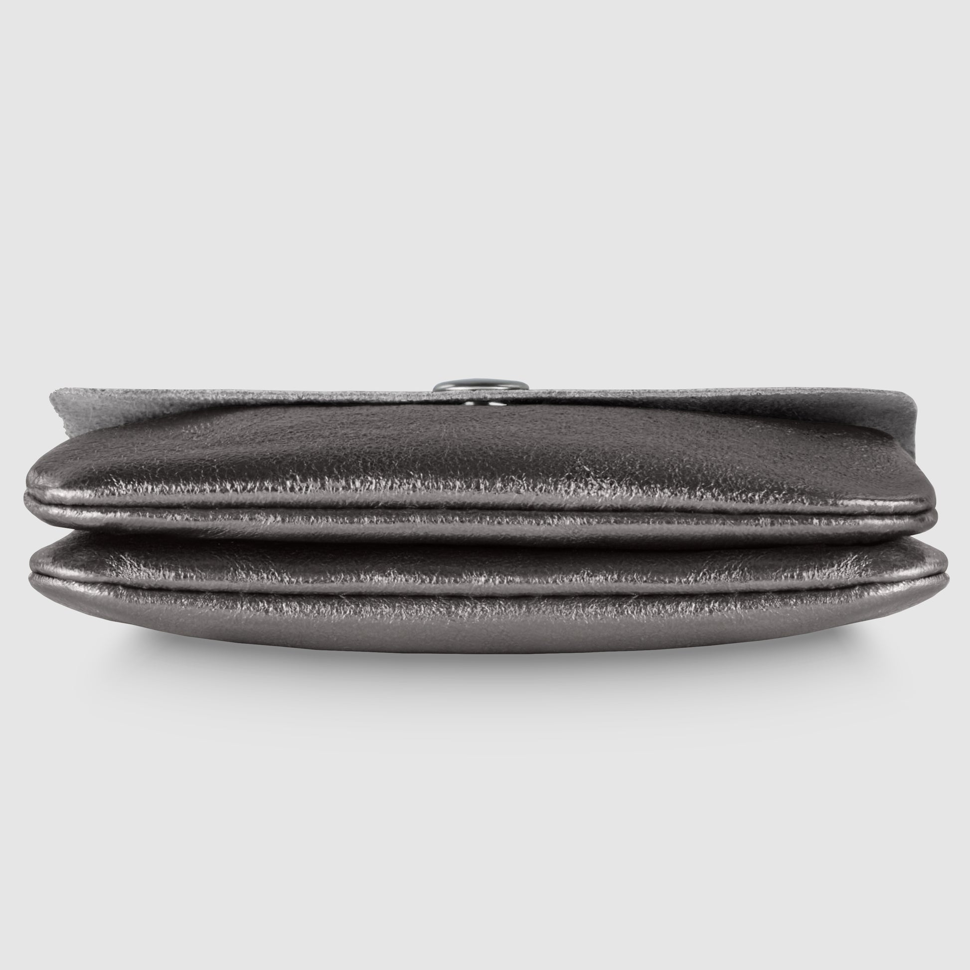 A metallic silver Gleam Suede Leather wallet, soft and stylish, is seen from the front with its top flap slightly open, lying flat against a plain light gray background.