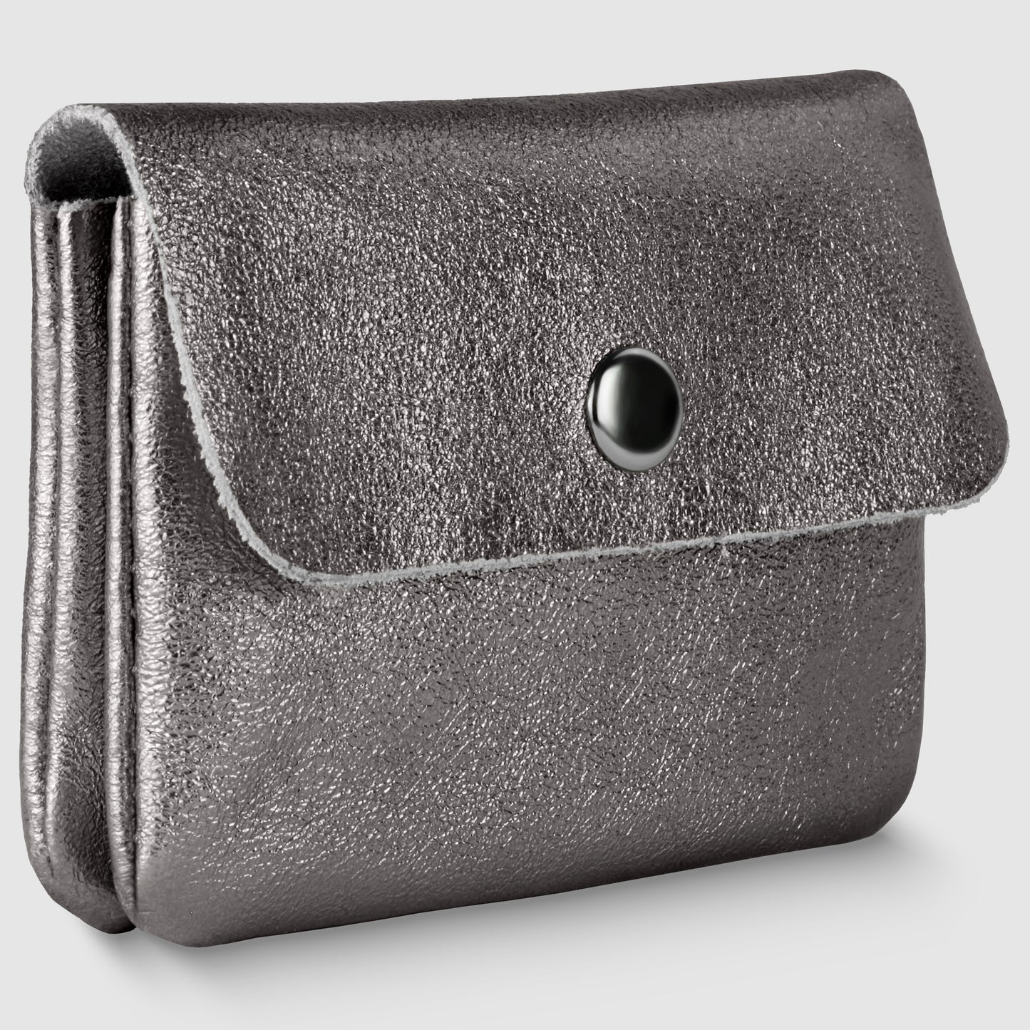 A metallic silver textured coin purse with a flap closure and black snap button, this women’s compact wallet exudes understated elegance, reminiscent of an Italian luxury wallet, shown on a plain light gray background.