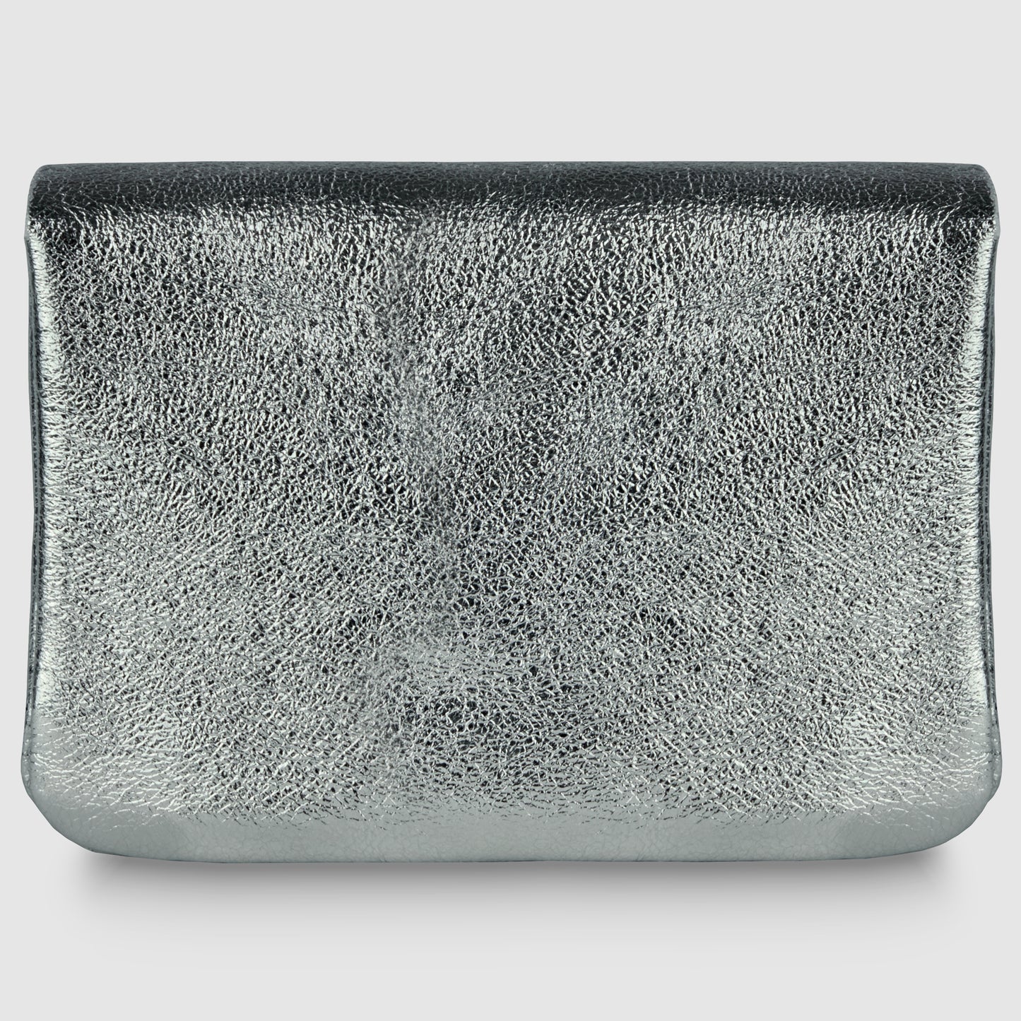A rectangular, silver metallic clutch bag with a textured, reflective surface embodies quiet luxury, displayed against a plain white background.