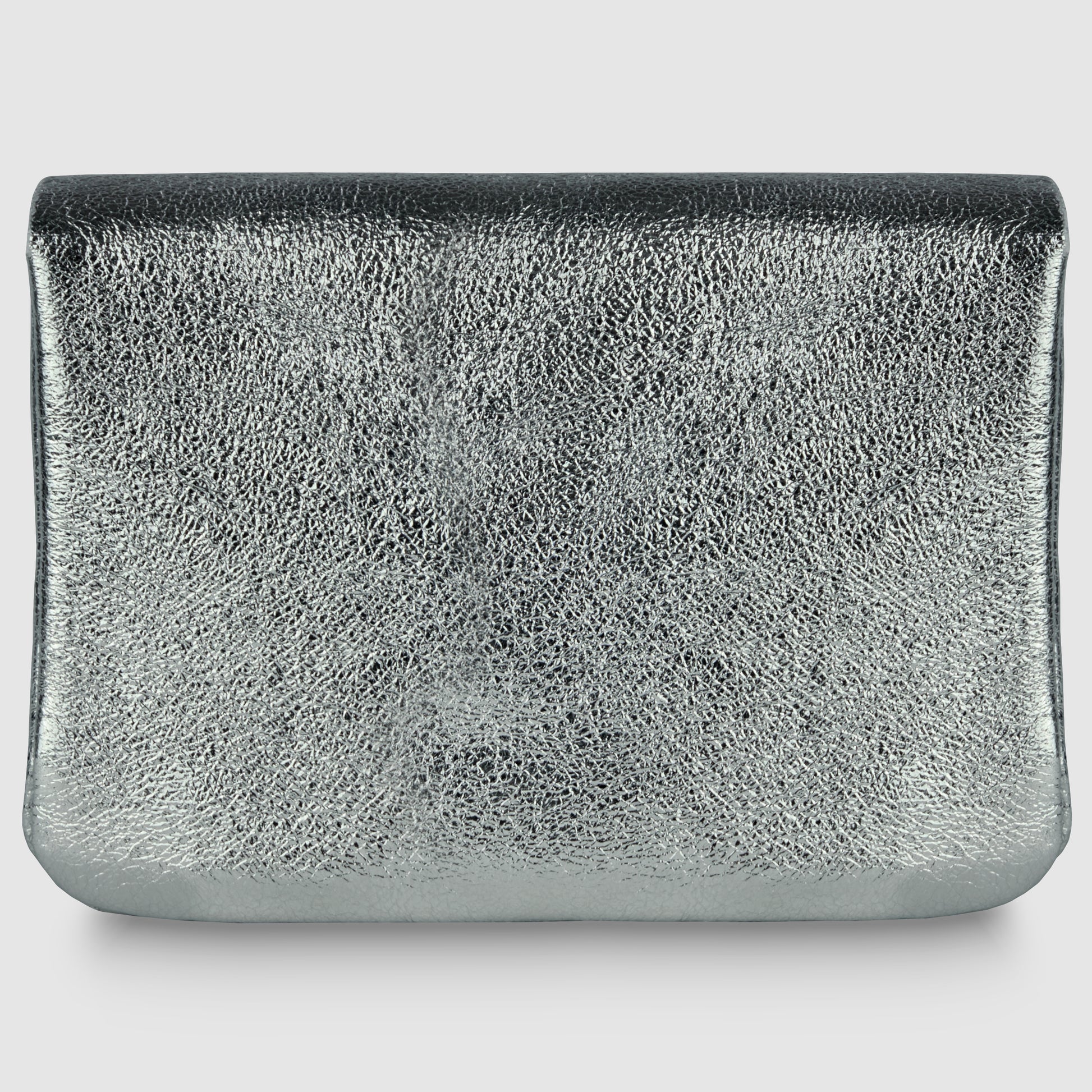A rectangular, silver metallic clutch bag with a textured, reflective surface embodies quiet luxury, displayed against a plain white background.