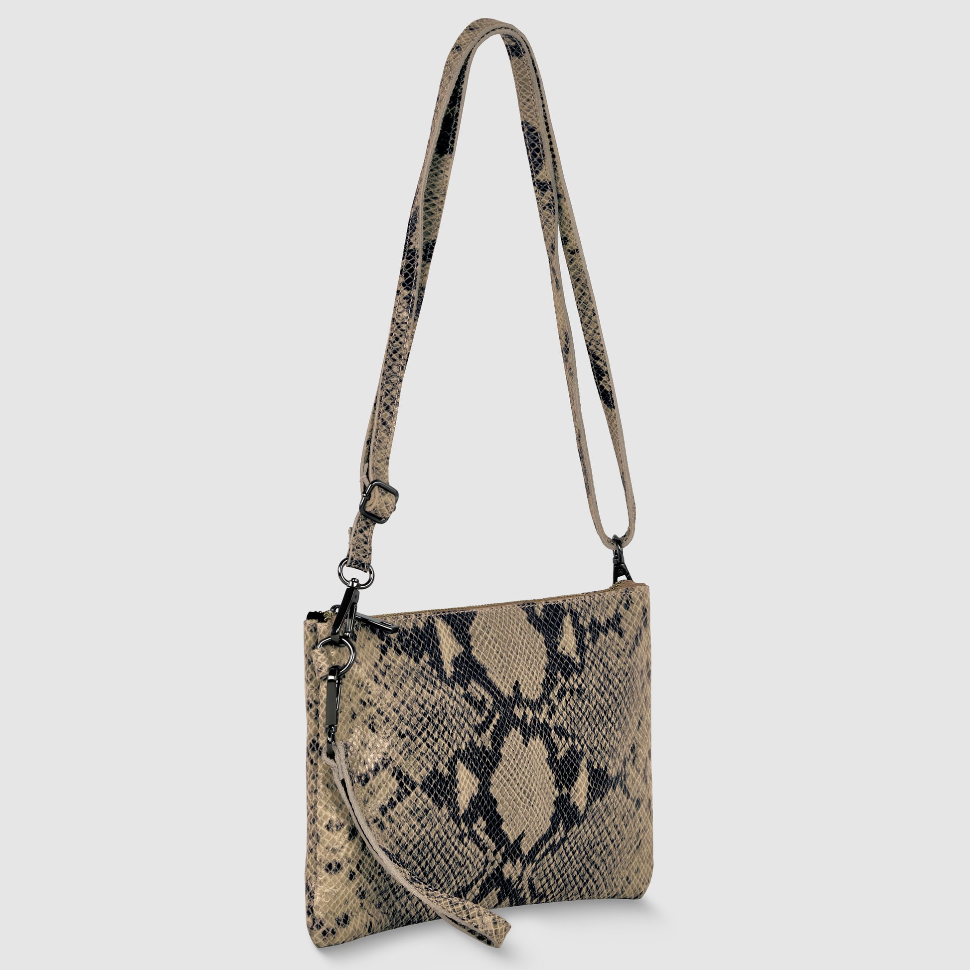 A rectangular crossbody wristlet with a beige and black snakeskin pattern, matching adjustable strap, and a small wrist strap, displayed against a plain light background—an elegant Italian handcrafted bag for any occasion.