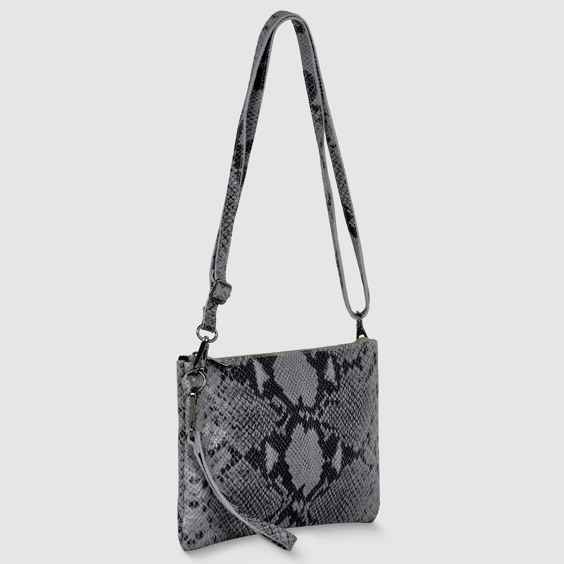 A gray python suede crossbody wristlet bag with a long adjustable strap and a detachable wristlet strap, displayed against a plain light gray background.