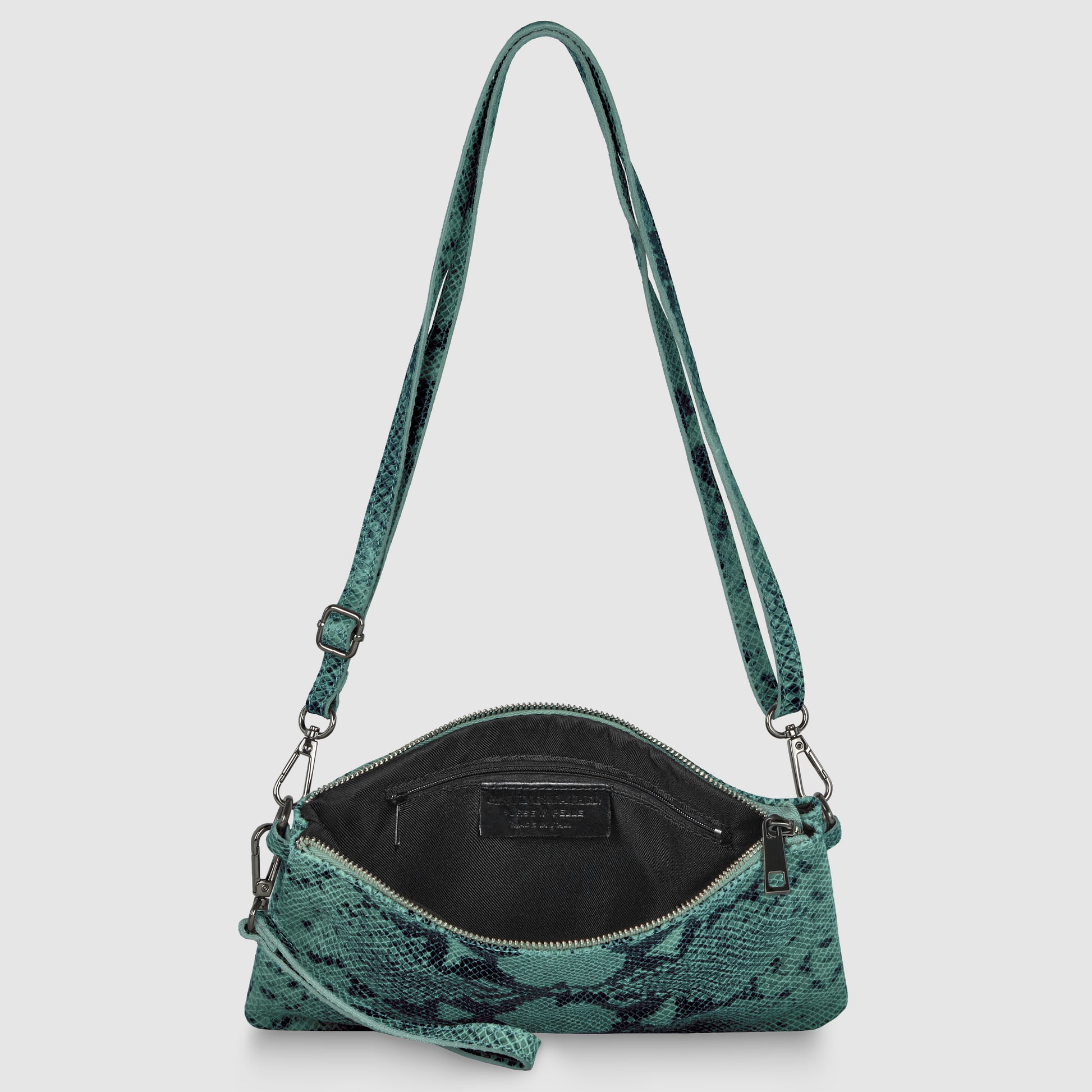 A small green python suede bag with a snakeskin pattern, wide shoulder strap, and zippered top, shown open to display the black interior and inner pocket.
