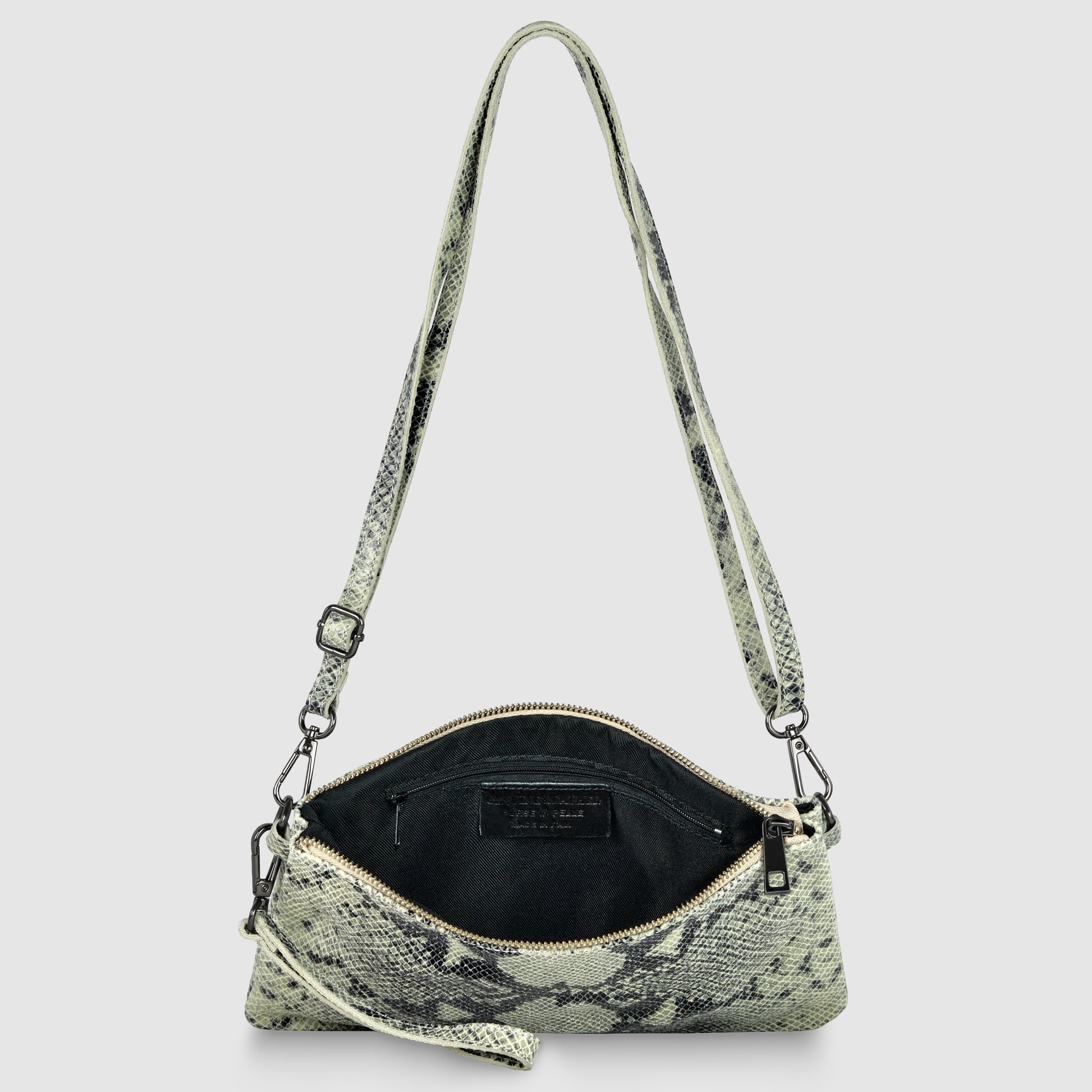 A small, rectangular python suede bag with a snakeskin pattern and zipper closure is shown open, revealing a black interior and adjustable strap, against a light gray background.