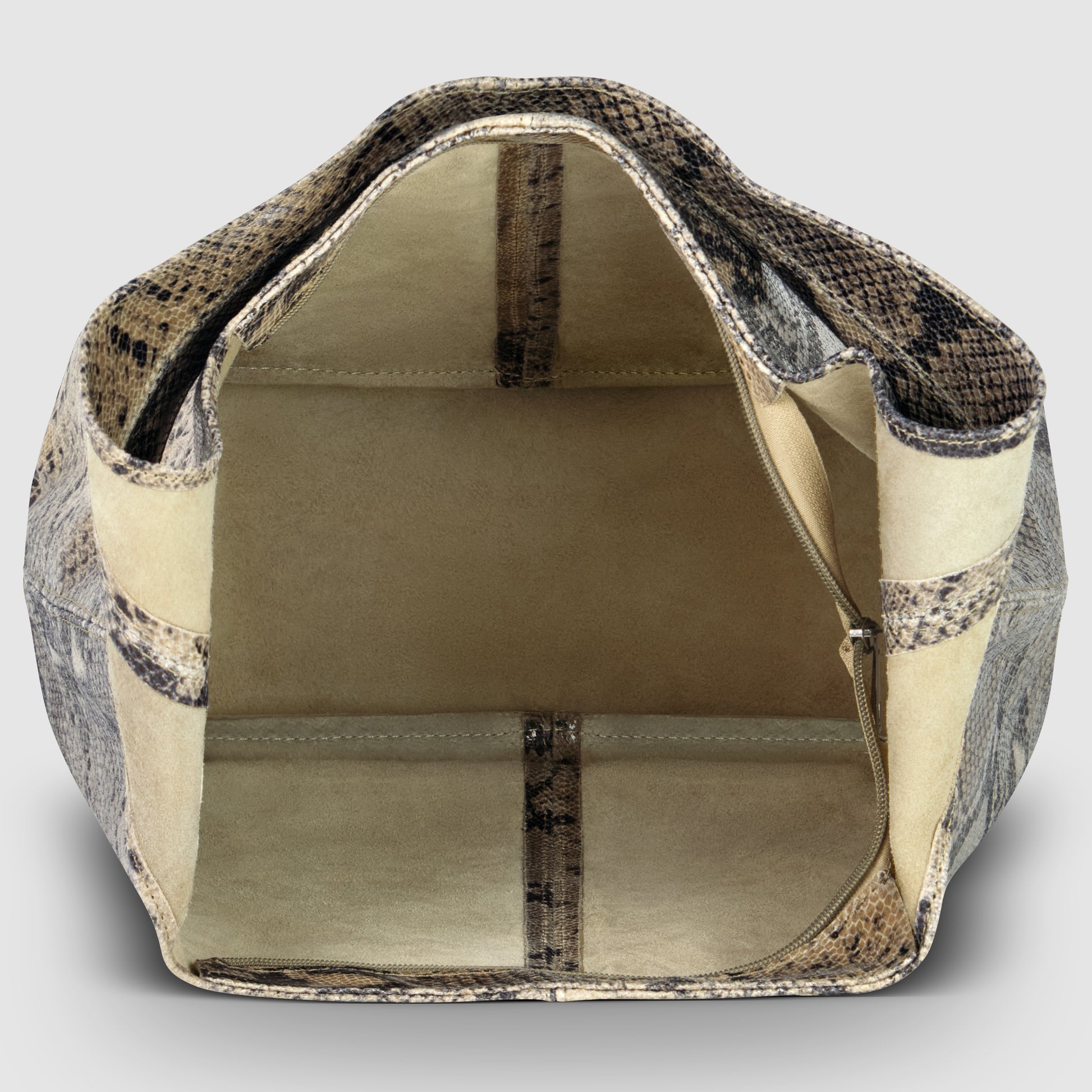 Open view of a beige and brown python embossed leather bag with a spacious, light tan suede interior, visible inner seams, and a side zippered pocket. The statement shoulder bag stands upright, displaying its empty interior.
