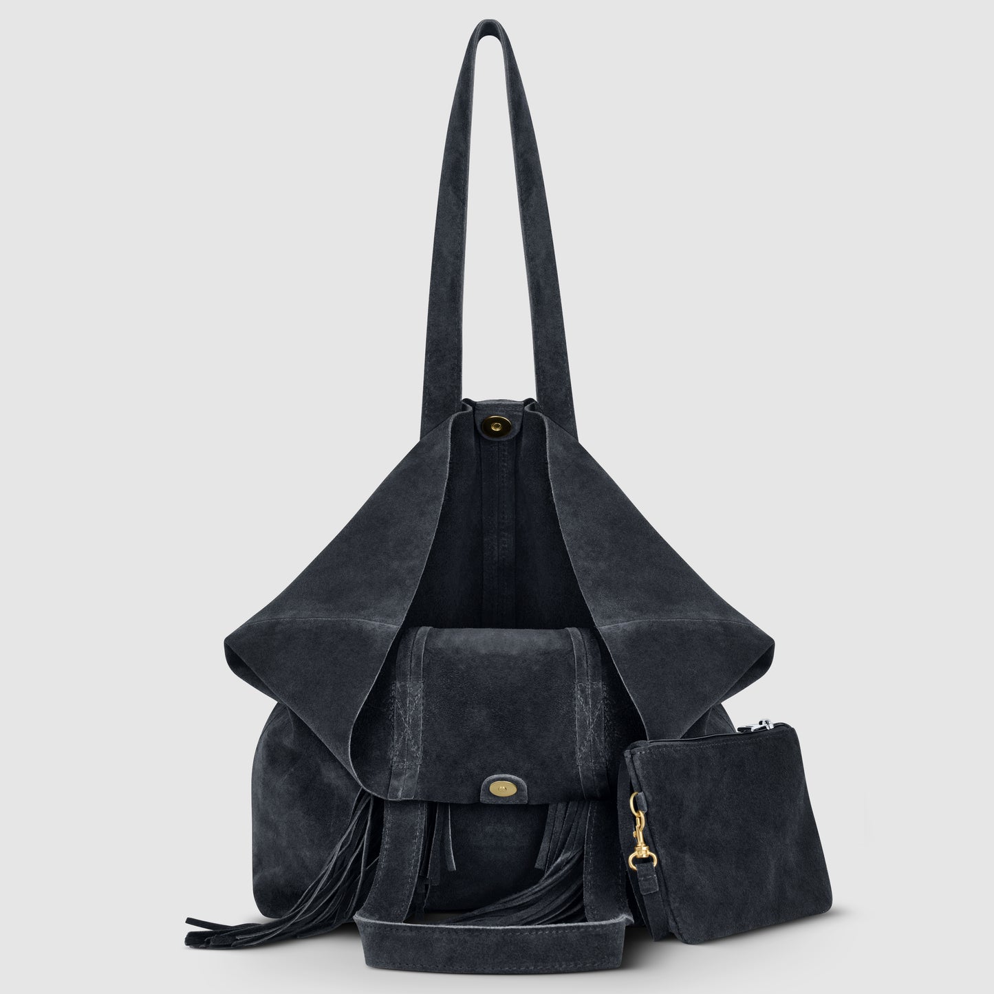 A dark grey suede handbag with long straps, an open flap, tassel details, and a matching zippered pouch placed in front, set against a light grey background.