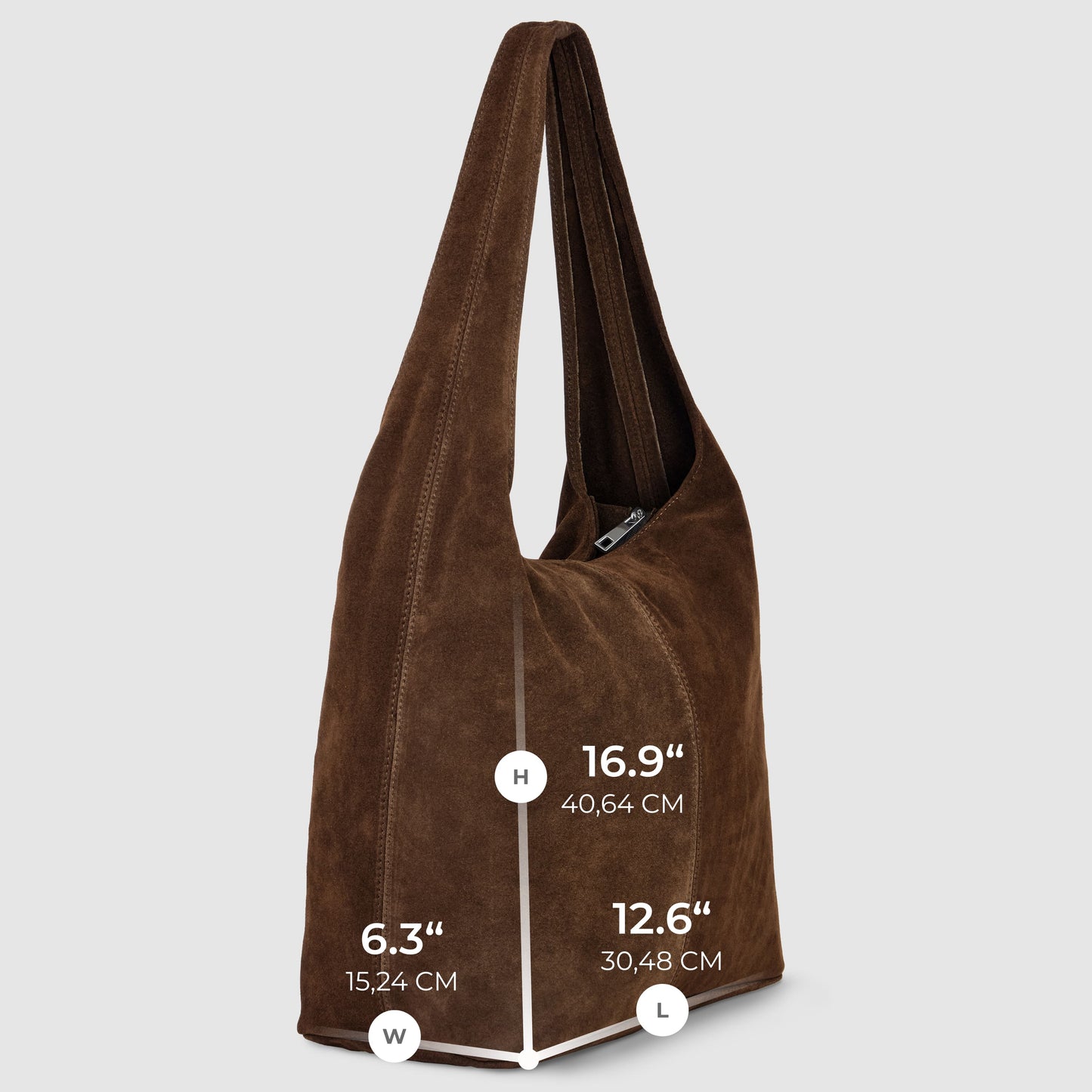 A spacious natural suede handbag in brown is shown upright with long straps. Dimensions: height 16.9" (40.64 cm), length 12.6" (30.48 cm), width 6.3" (15.24 cm). The background is light gray for this elegant accessory.