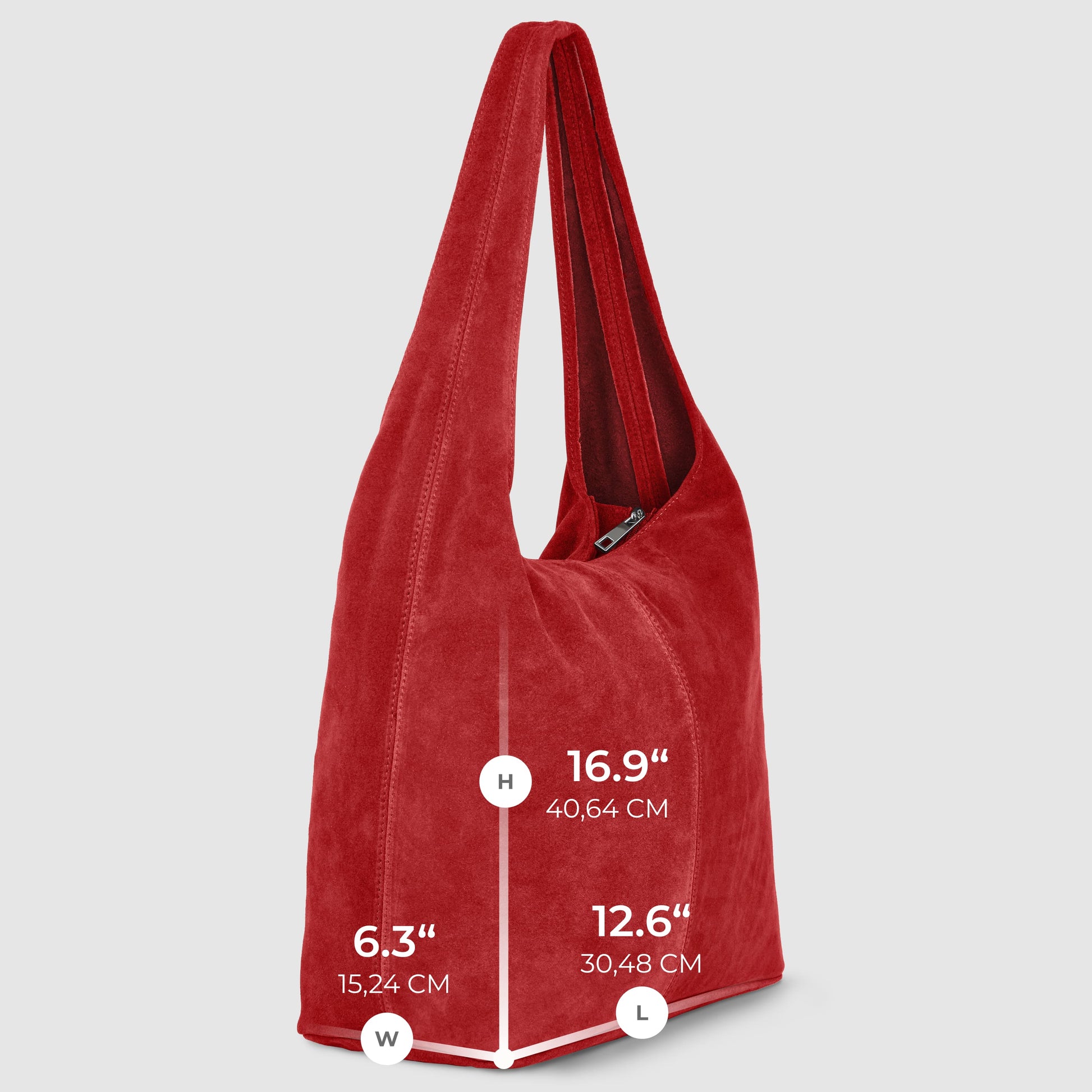 A spacious natural suede handbag in vibrant red stands upright, featuring a single strap. White measurement lines indicate its dimensions: height 16.9" (40.64 cm), length 12.6" (30.48 cm), and width 6.3" (15.24 cm).