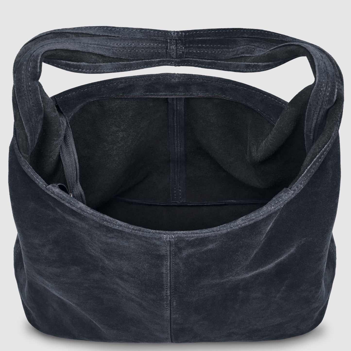 A large, black, Italian handcrafted bag is shown from above with an open top, revealing the spacious interior and an inside zippered pocket against a plain light gray background.