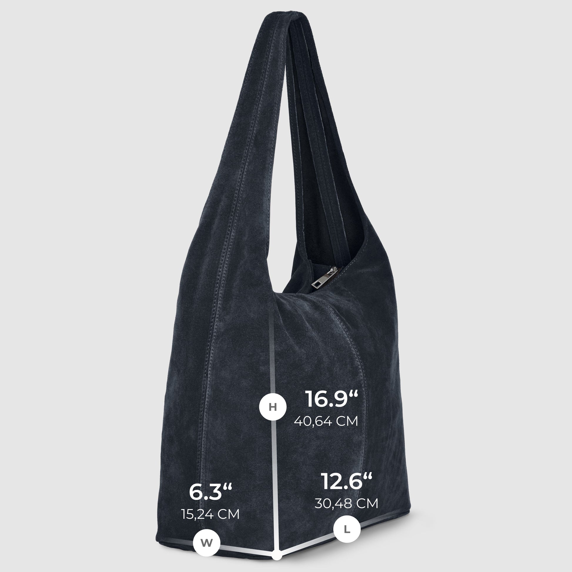 A slouchy suede shoulder purse in dark blue with dimensions: height 16.9 (40.64 cm), width 6.3 (15.24 cm), and length 12.6 (30.48 cm), set against a light gray background.
