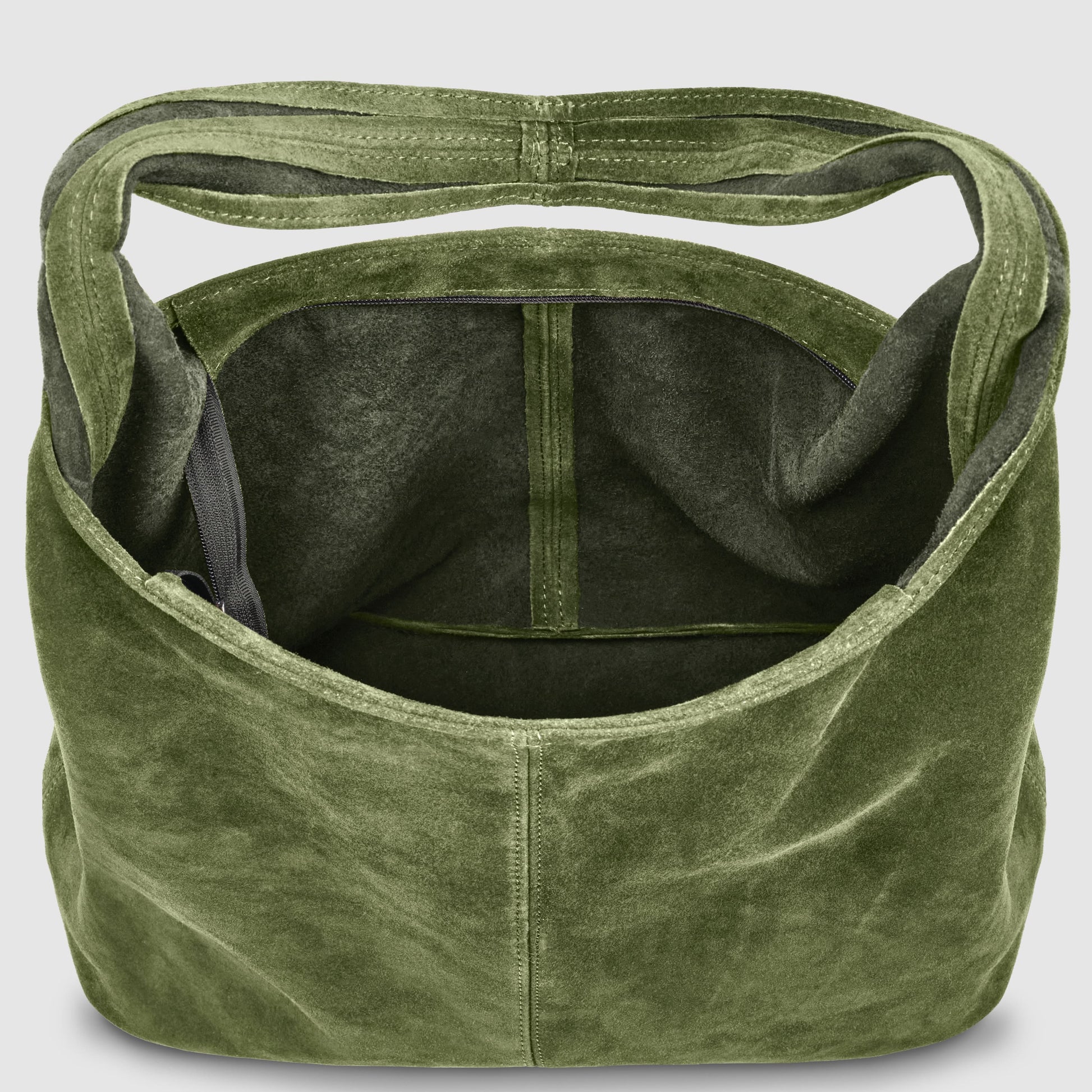 Olive green slouchy suede shoulder purse with a wide strap, shown from above with the interior visible, featuring a fabric-lined compartment and a small side pocket.