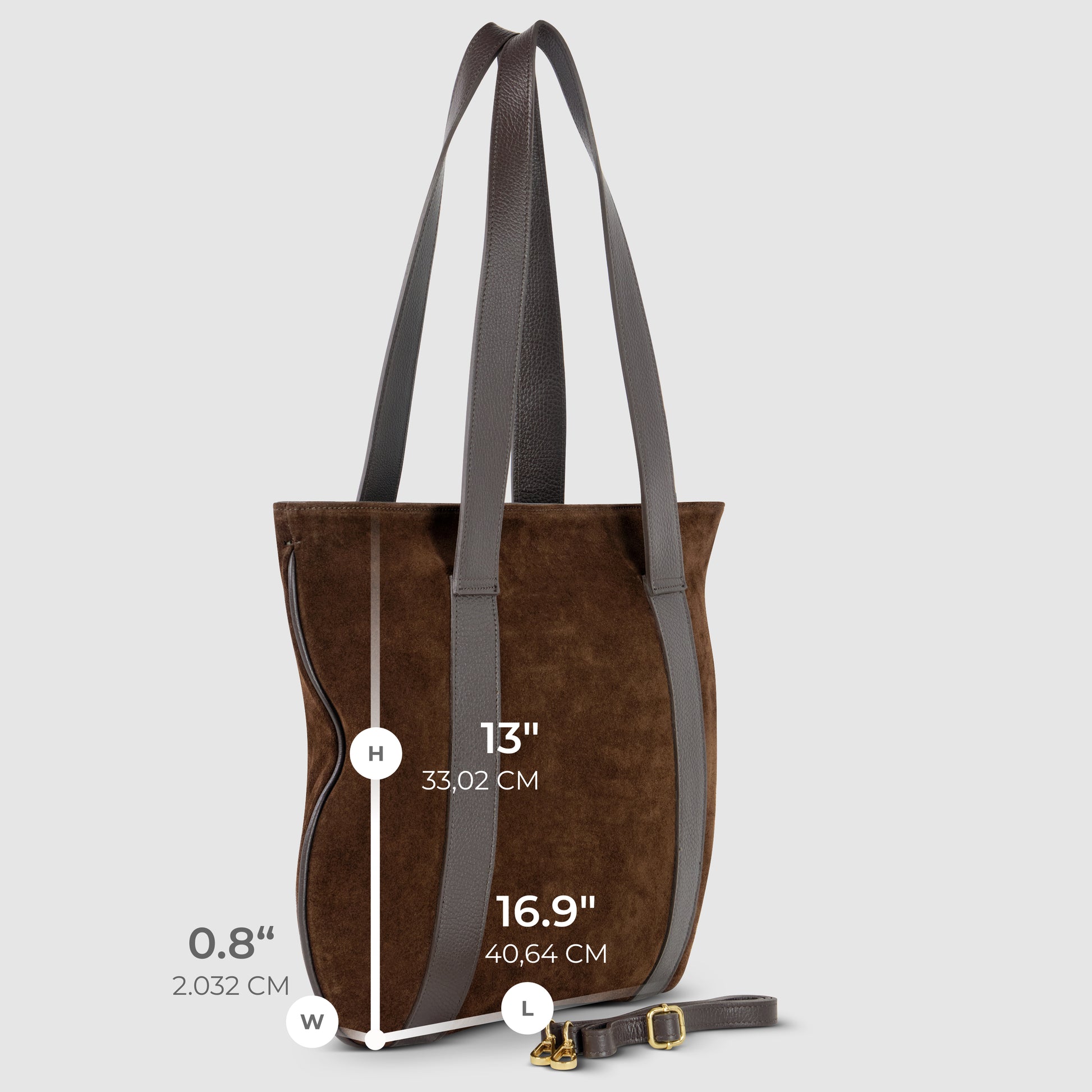 A genuine suede bag with dark handles, shown upright. Dimensions: height 16.9" (40.64 cm), width 0.8" (2.032 cm), handle drop 13" (33.02 cm). Detachable strap lies beside this Italian style handbag.