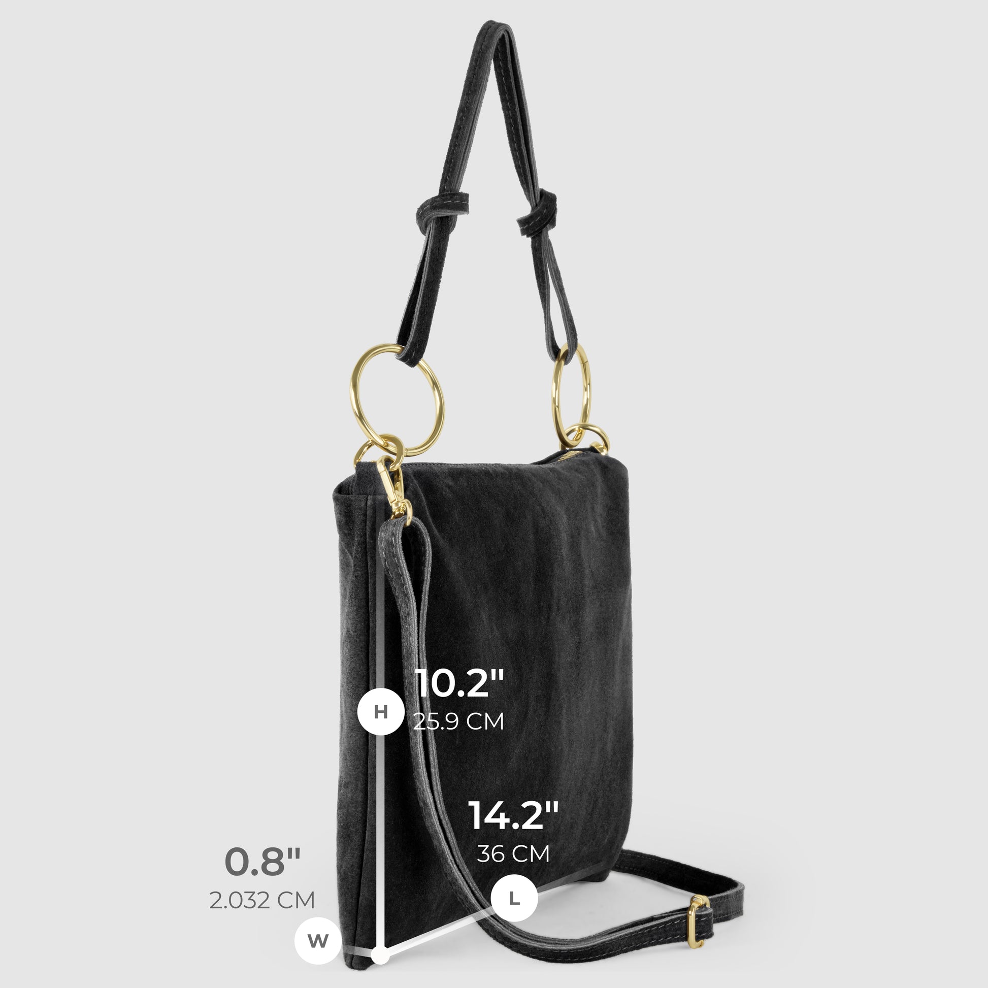 A black slim medium purse with gold rings on the straps is shown against a light gray background. The bag’s dimensions are 10.2 high, 14.2 long, and 0.8 wide (25.9 x 36 x 2 cm).