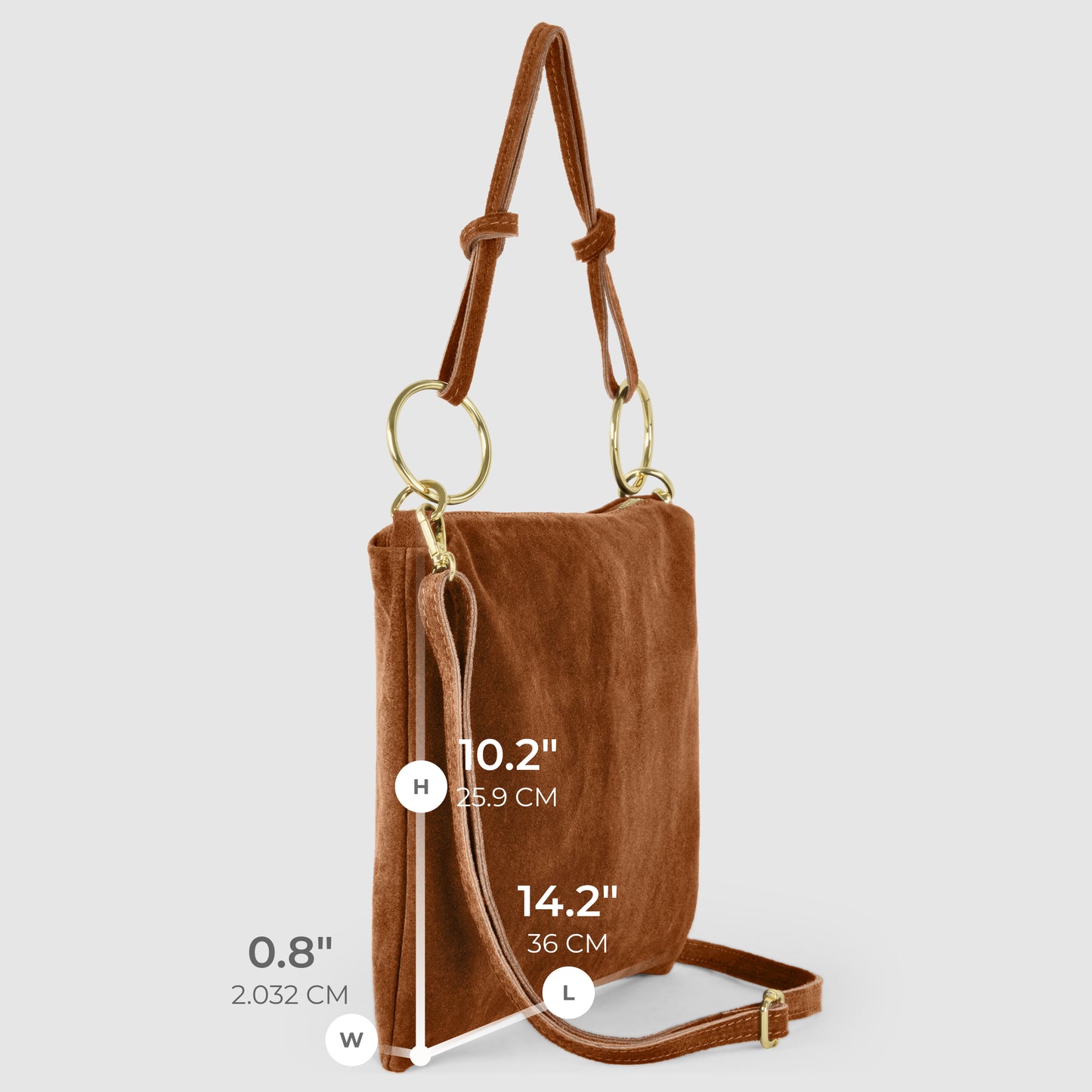 Brown Italian suede purse with gold hardware, adjustable strap, and ring accents. Medium zip closure with real suede leather handbag quality. Dimensions: Height 10.2" (25.9 cm), Length 14.2" (36 cm), Width 0.8" (2.03 cm). Light grey background.