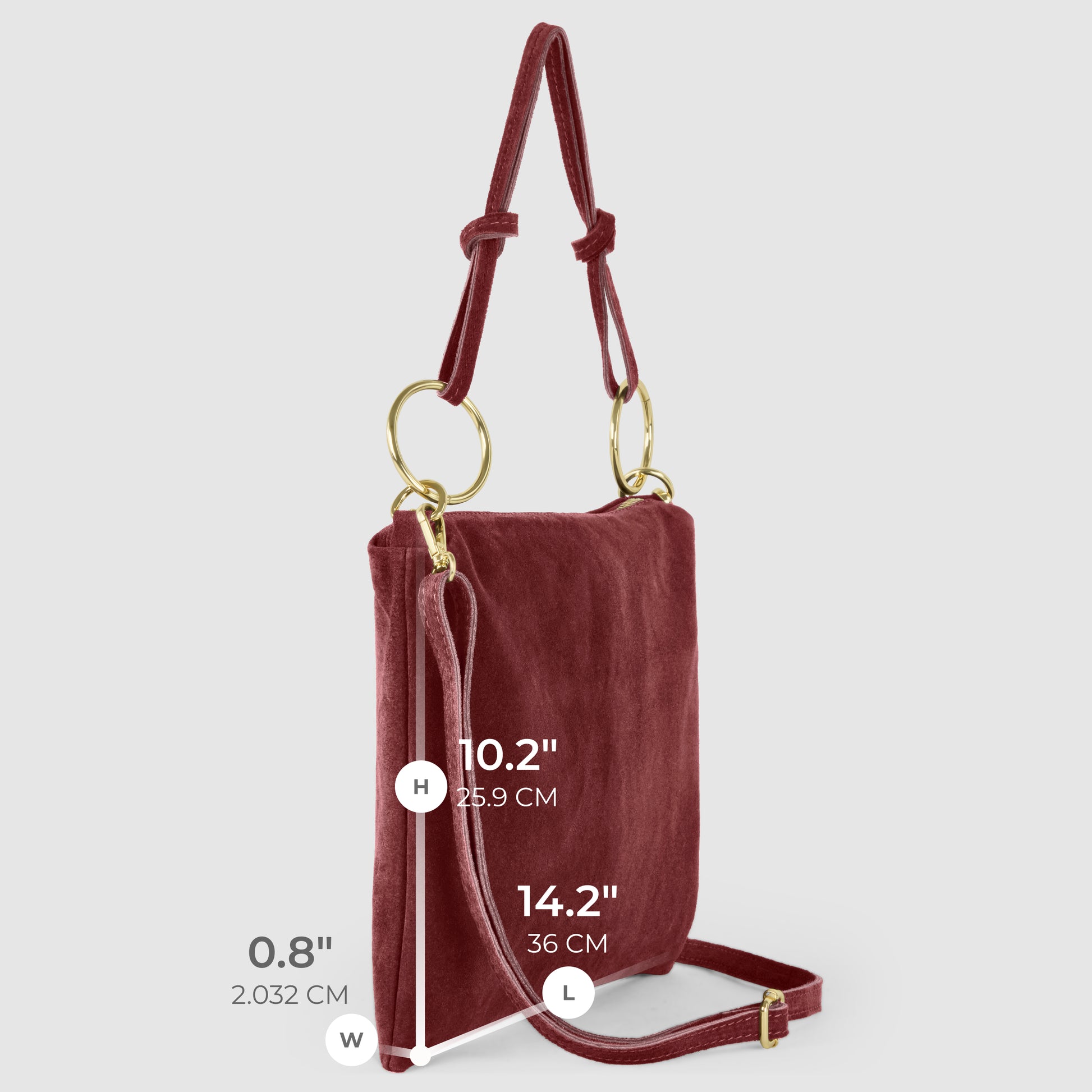 A slim medium purse in burgundy velvet with gold rings, adjustable strap, and labeled dimensions: height 10.2 inches (25.9 cm), length 14.2 inches (36 cm), width 0.8 inches (2.032 cm).