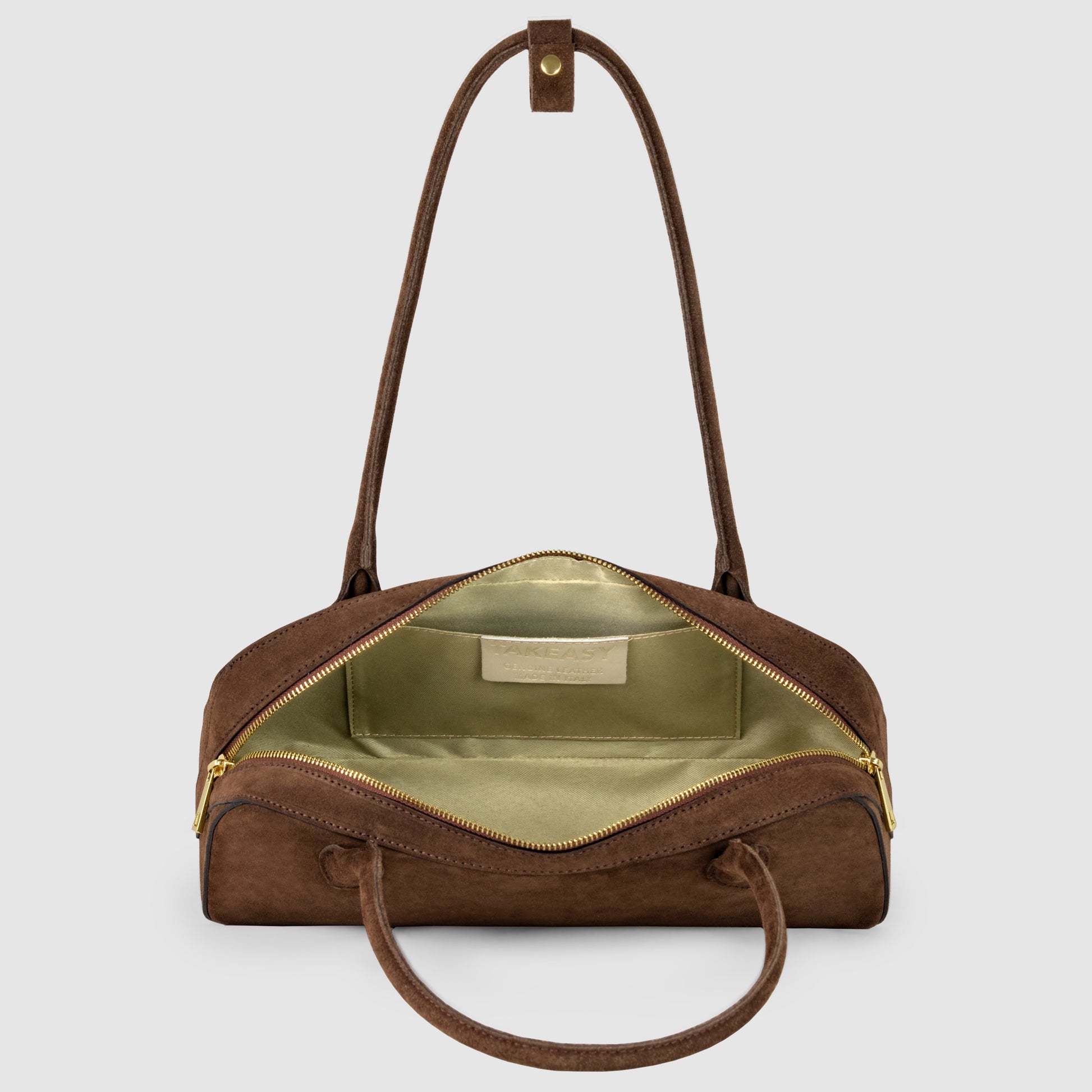 A premium quality Italian suede leather bag with gold zippers, tan handles, and a green satin interior, shown open to display its spacious main compartment.