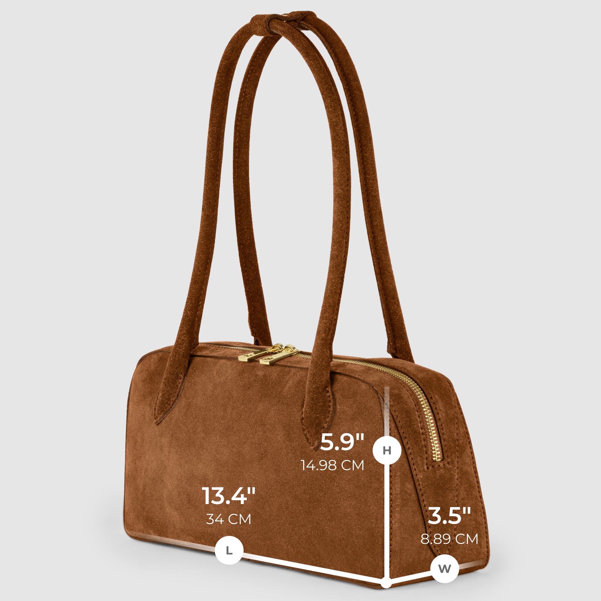 A genuine suede bag with two long handles and gold zippers. Handmade in Italy, this brown handbag measures 13.4" (34 cm) long, 5.9" (14.98 cm) high, and 3.5" (8.89 cm) wide—perfect for stylish everyday use.