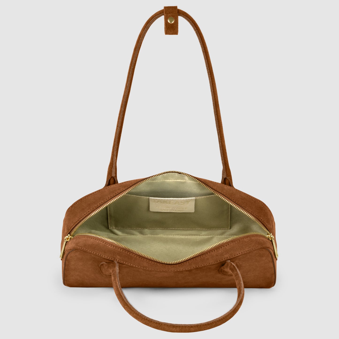 A genuine suede bag with gold zippers, shown open to reveal a light green fabric interior and an inner pocket. The bag features two handles and a detachable shoulder strap for versatile style.