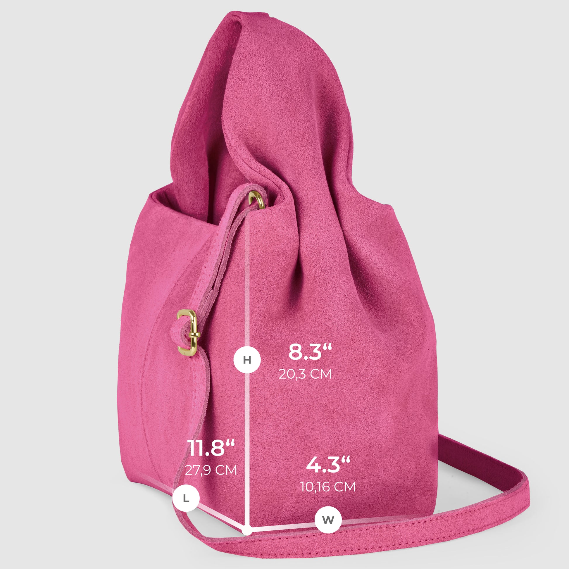 A pink handcrafted suede bag with a shoulder strap is displayed upright, showcasing Italian craftsmanship. Dimensions are labeled: height 8.3 inches (20.3 cm), length 11.8 inches (27.9 cm), and width 4.3 inches (10.16 cm).