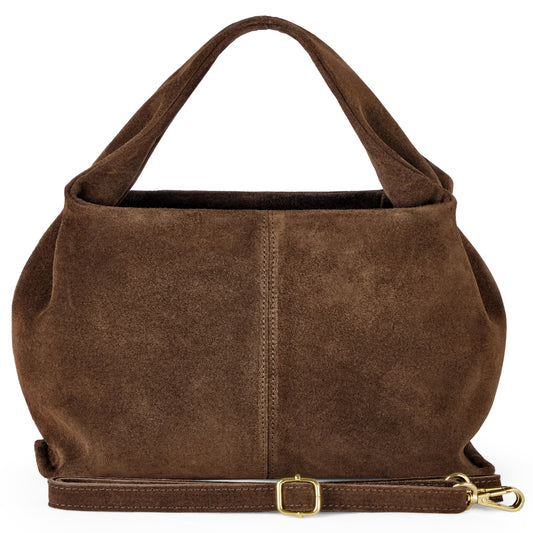 A brown handcrafted suede bag with a soft, rounded shape, sturdy handle, front seam detail, and a detachable adjustable strap featuring a gold buckle and clasp, showcases exceptional Italian craftsmanship against a white background.
