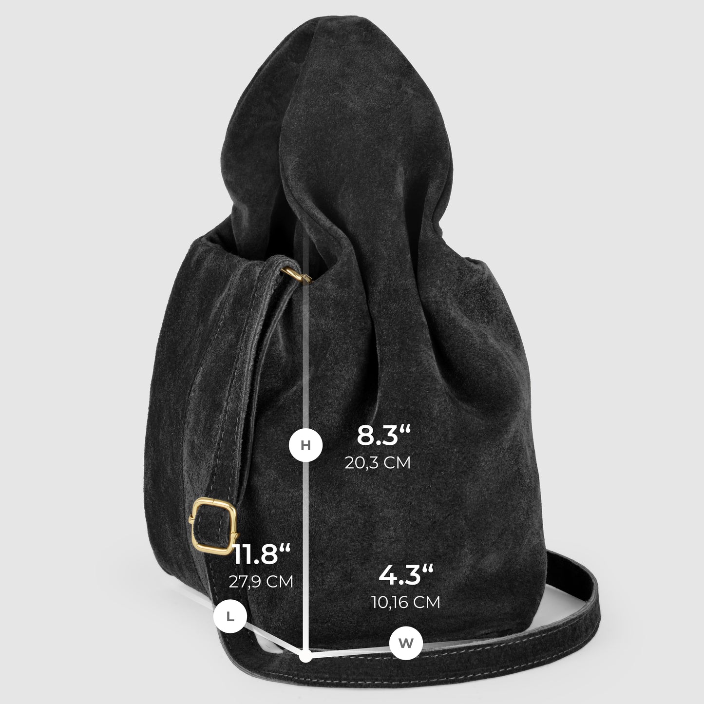 A black suede handbag with a long strap and gold buckle is shown upright. Overlay text displays measurements: height 8.3 (20.3 cm), length 11.8 (27.9 cm), width 4.3 (10.16 cm). Experience timeless Italian craftsmanship in every detail.