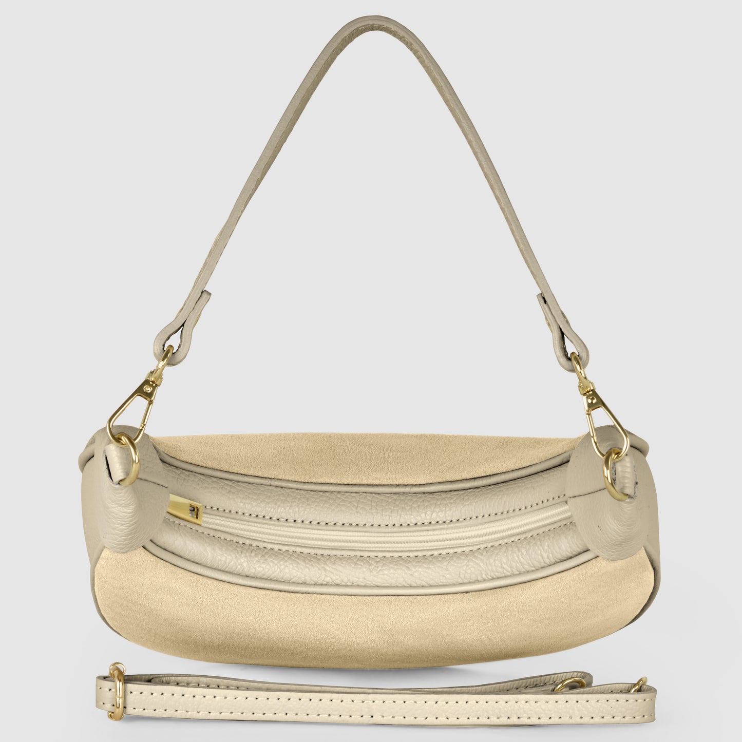 A beige Italian leather bag with gold hardware, a curved front zipper pocket, a detachable shoulder strap, and a removable crossbody strap, displayed on a light gray background.
