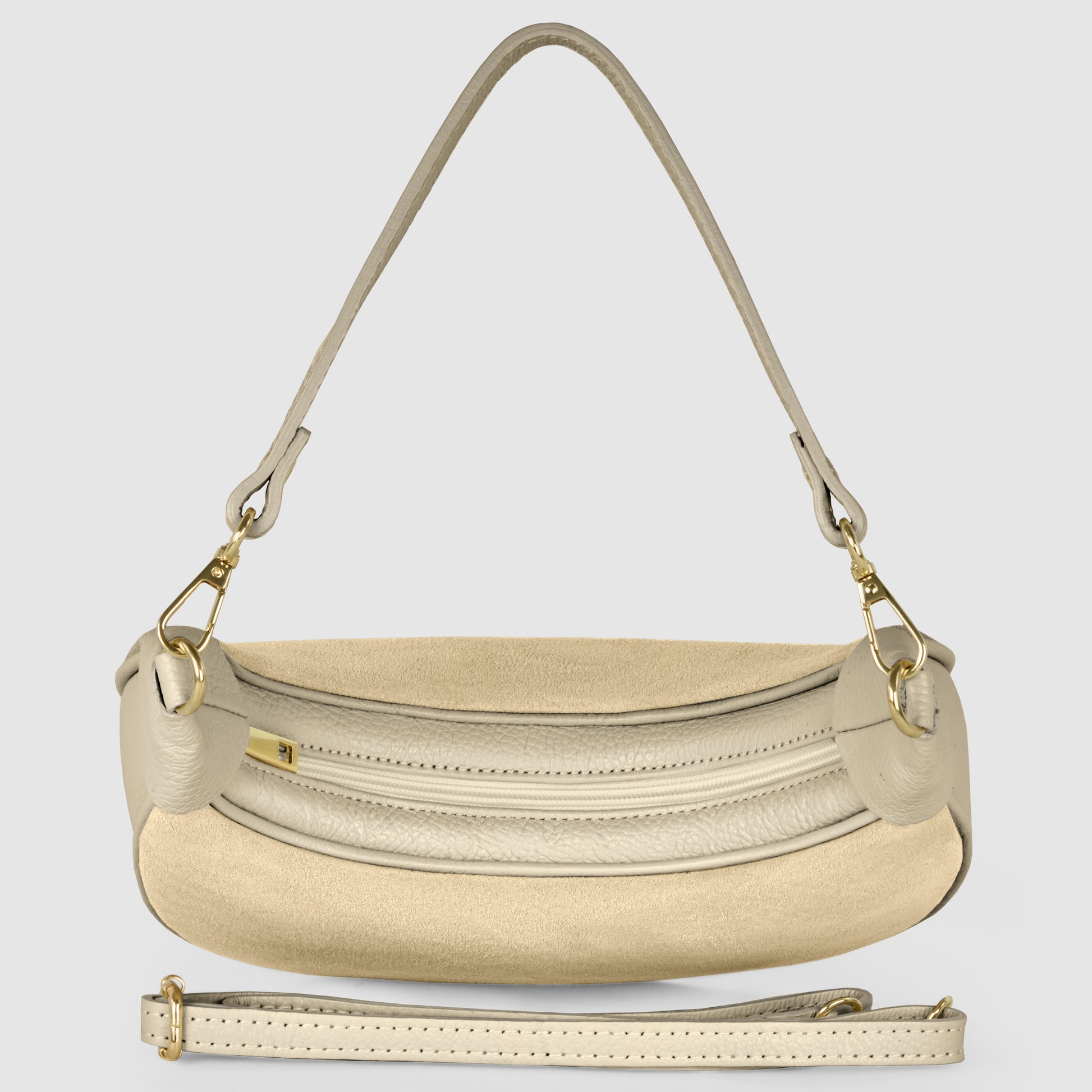 A beige Italian leather bag with gold hardware, a curved front zipper pocket, a detachable shoulder strap, and a removable crossbody strap, displayed on a light gray background.