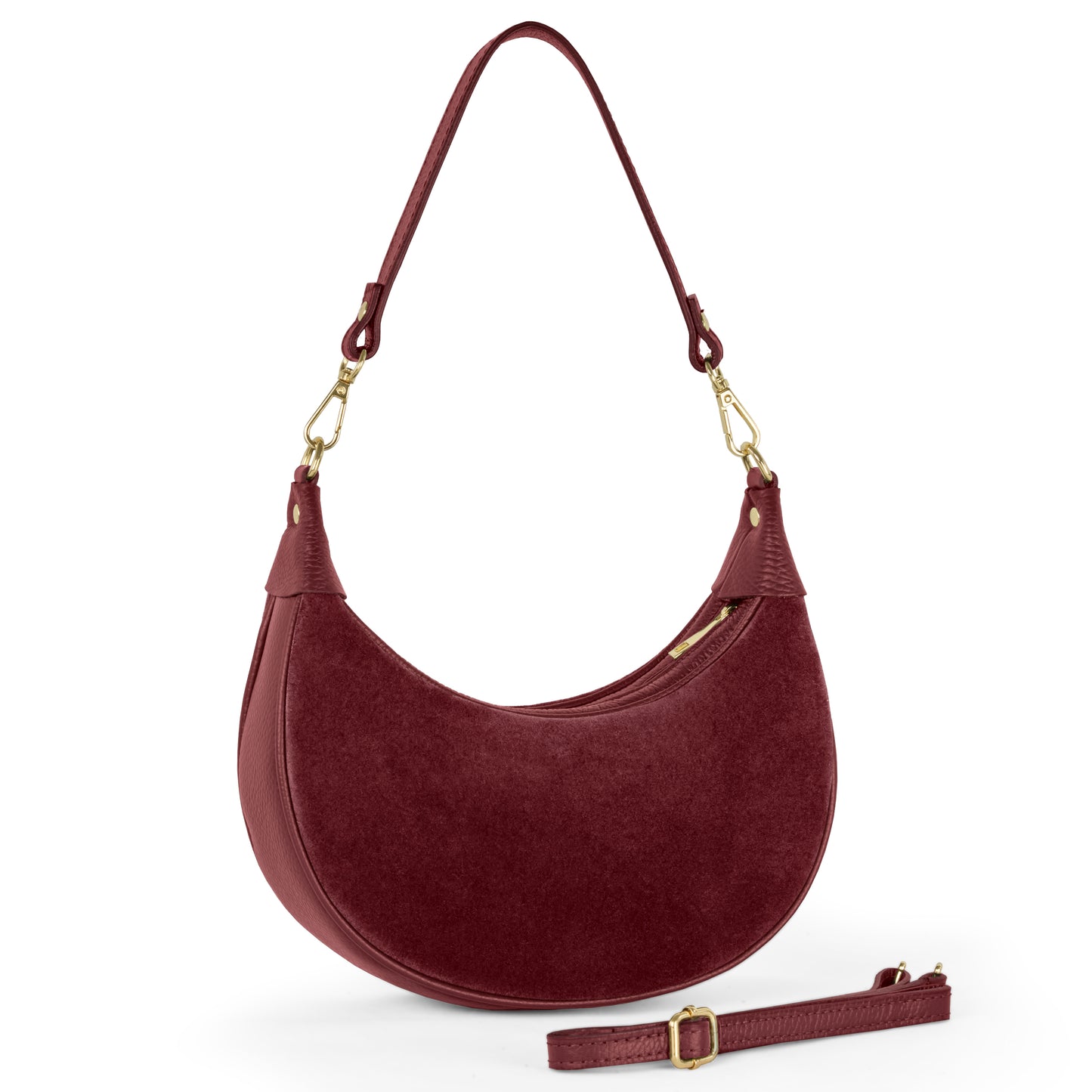 A burgundy suede crescent handbag with gold-tone hardware, a top handle, zippered closure, and a removable adjustable shoulder strap. Crafted from Italian leather with a smooth, suede-like texture.