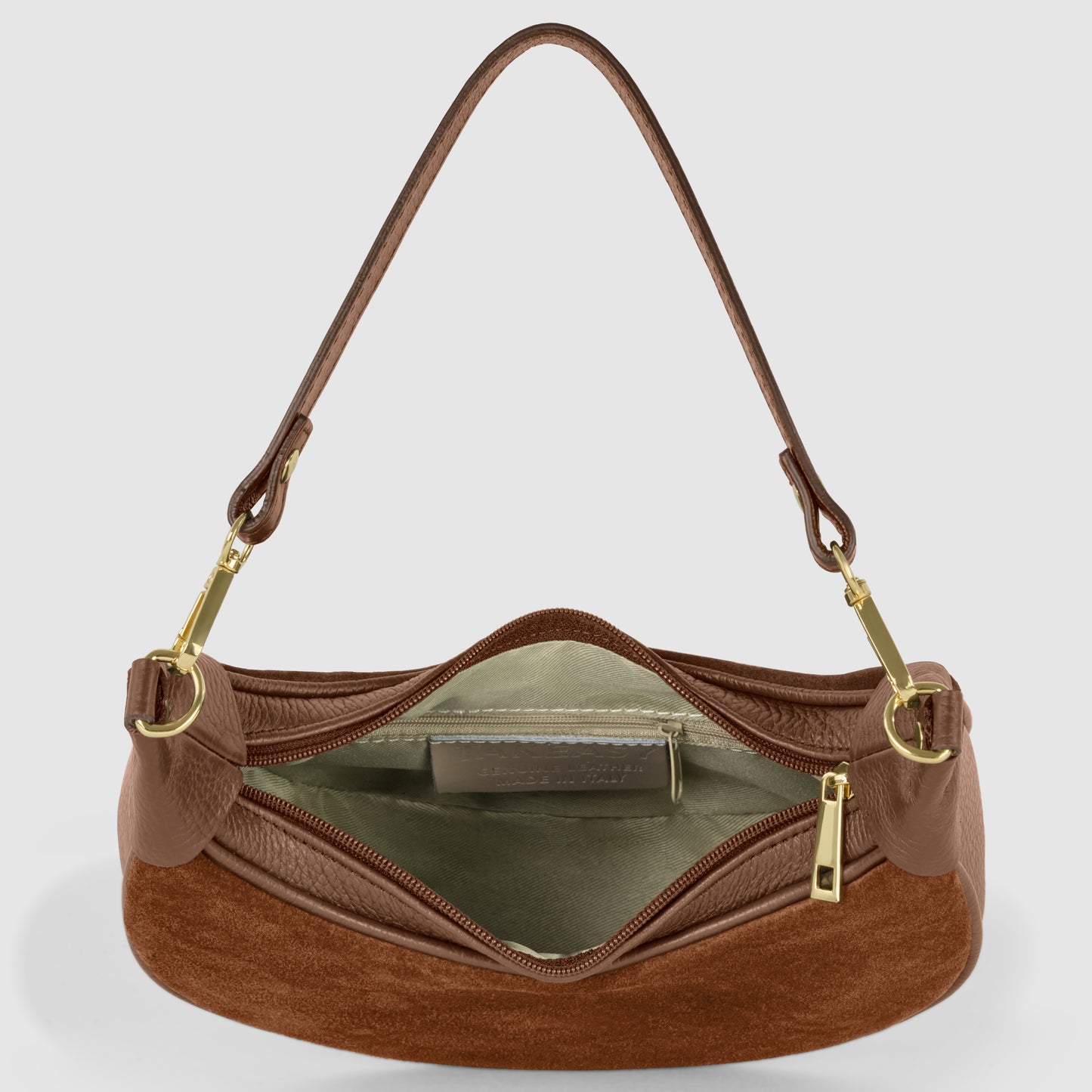 A brown Italian leather bag with gold hardware is shown from above, unzipped to reveal a light interior lining and an inner zippered pocket. The single strap is attached with gold clasps.