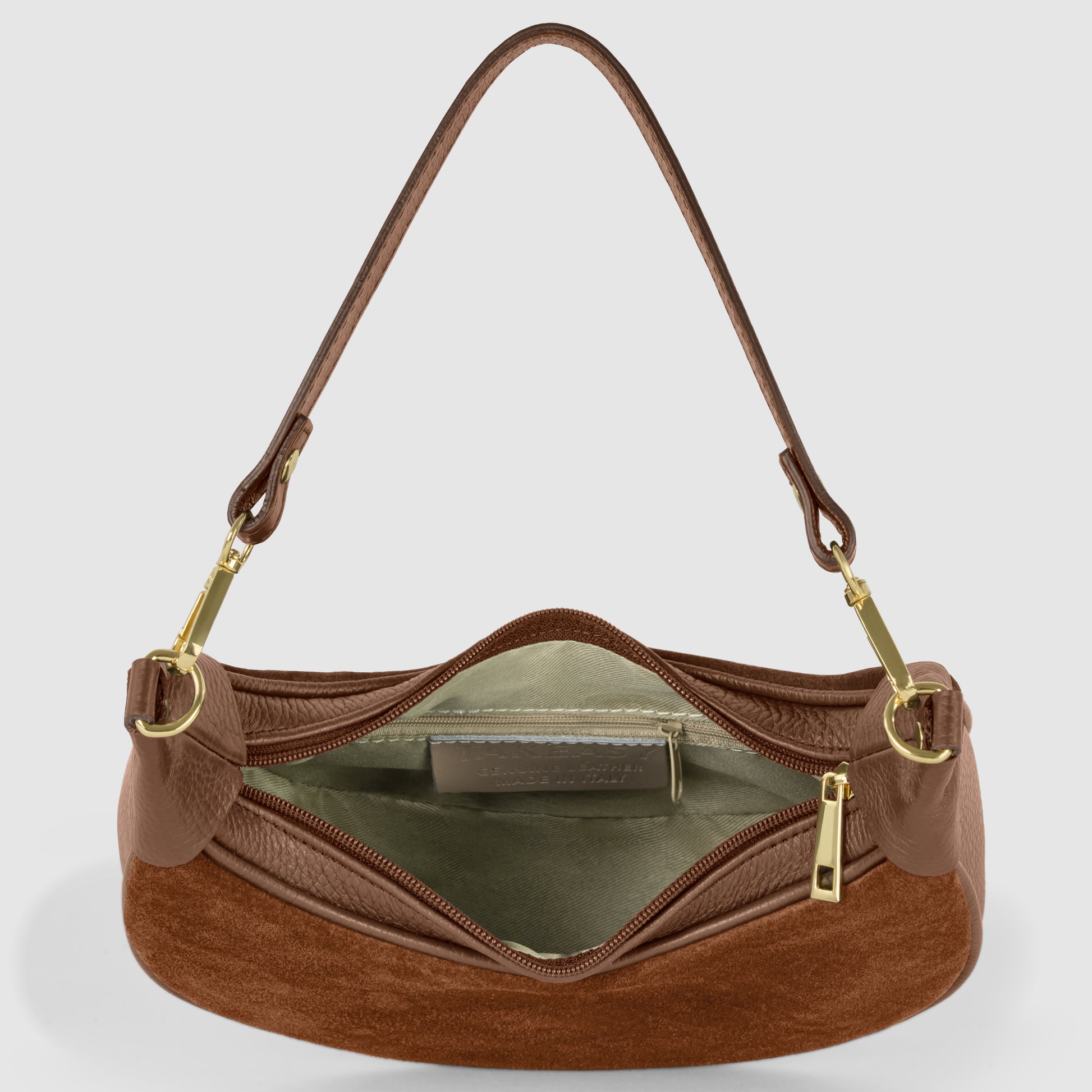 A brown Italian leather bag with gold hardware is shown from above, unzipped to reveal a light interior lining and an inner zippered pocket. The single strap is attached with gold clasps.