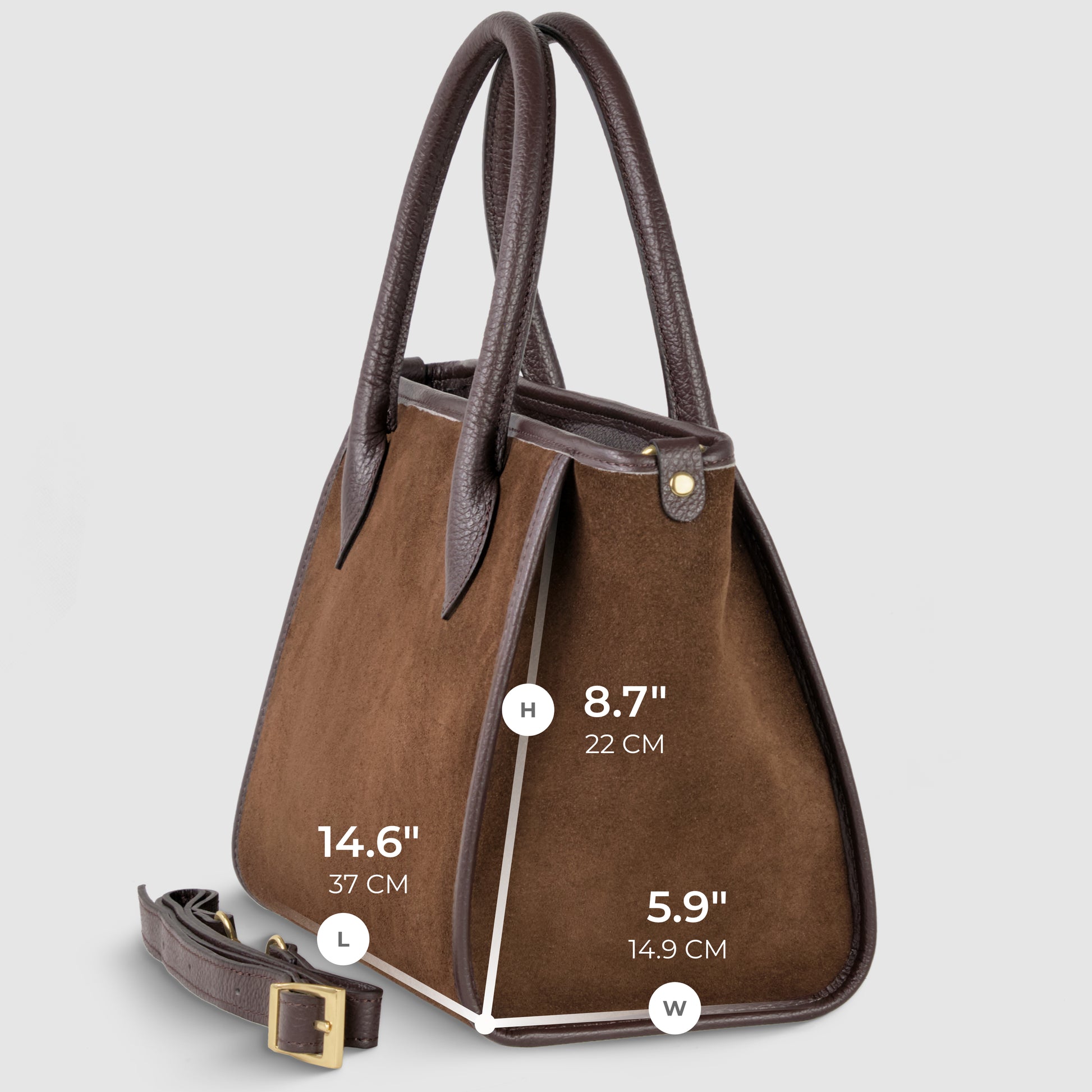 A brown Italian handcrafted bag in suede leather with dark brown handles and trim, shown in side view. Dimensions: height 8.7" (22 cm), length 14.6" (37 cm), width 5.9" (14.9 cm). Includes a detachable strap for crossbody carryall versatility.