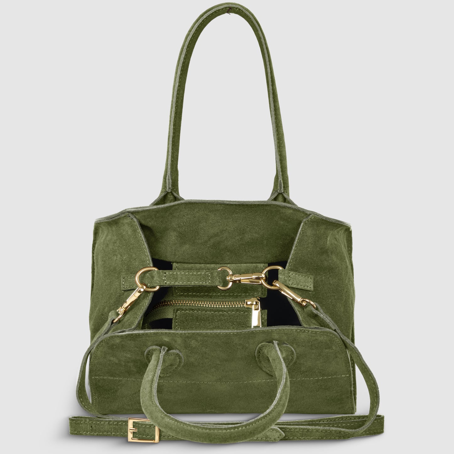A green Italian suede handbag with gold hardware, handmade in Italy by Florentine leather artisans, featuring two handles, a detachable shoulder strap, and a matching wallet inside the open front pocket.