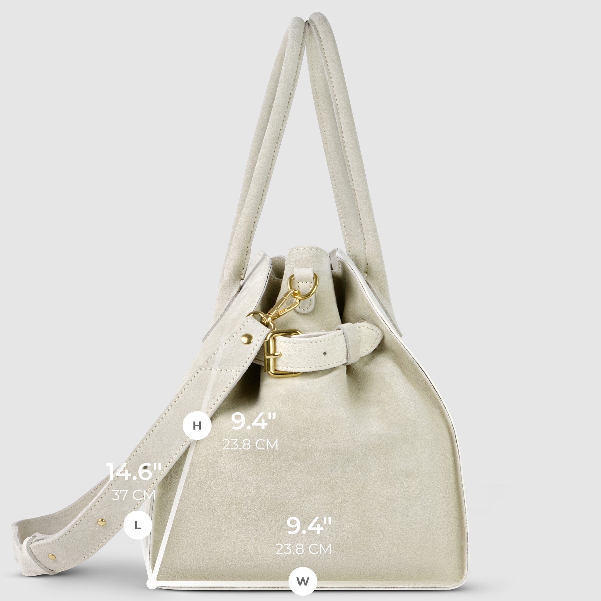 Side view of a structured medium Italian suede handbag with gold hardware, two handles, and a detachable strap. Handcrafted in Italy. Dimensions: height 14.6" (37 cm), handle drop 9.4" (23.8 cm), width 9.4" (23.8 cm).