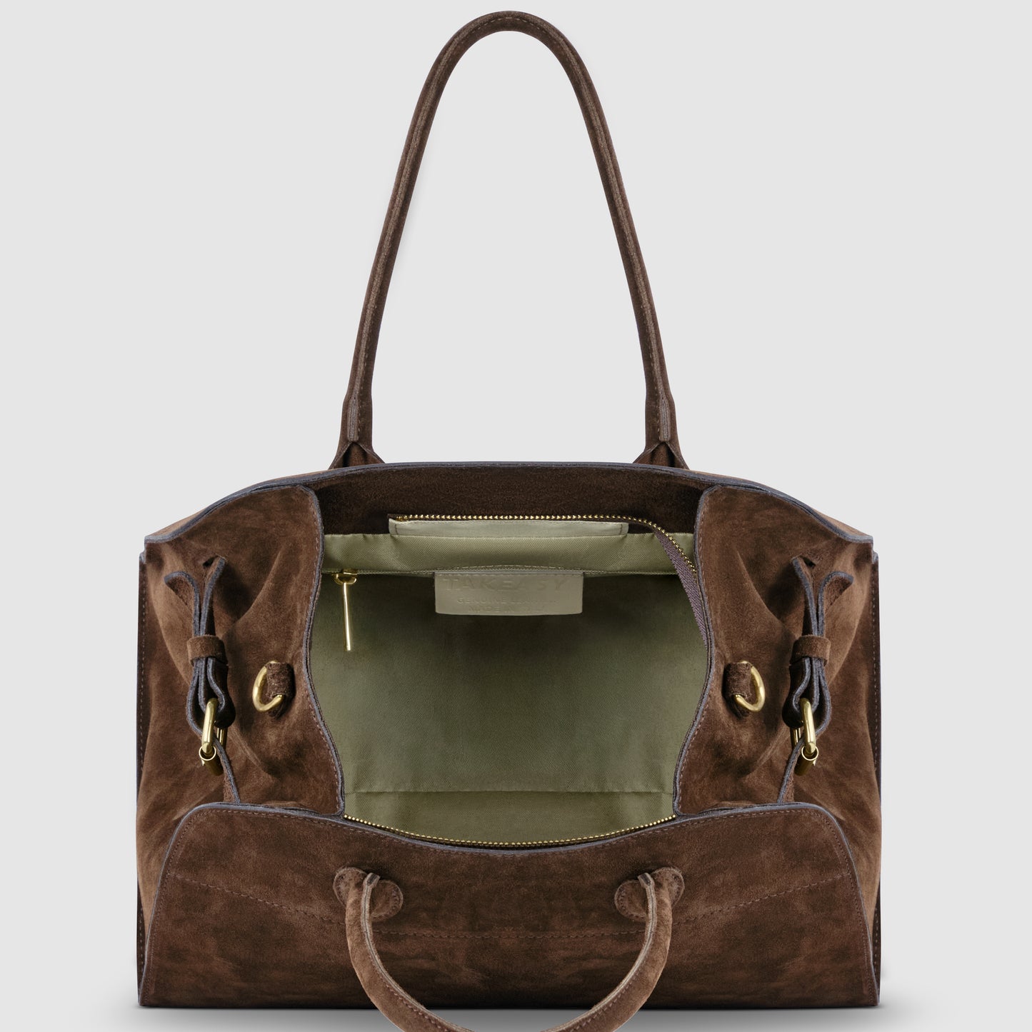 A handcrafted Italian suede tote bag with genuine leather handles and gold hardware, shown open to reveal a spacious, light green fabric-lined interior and a zippered pocket.
