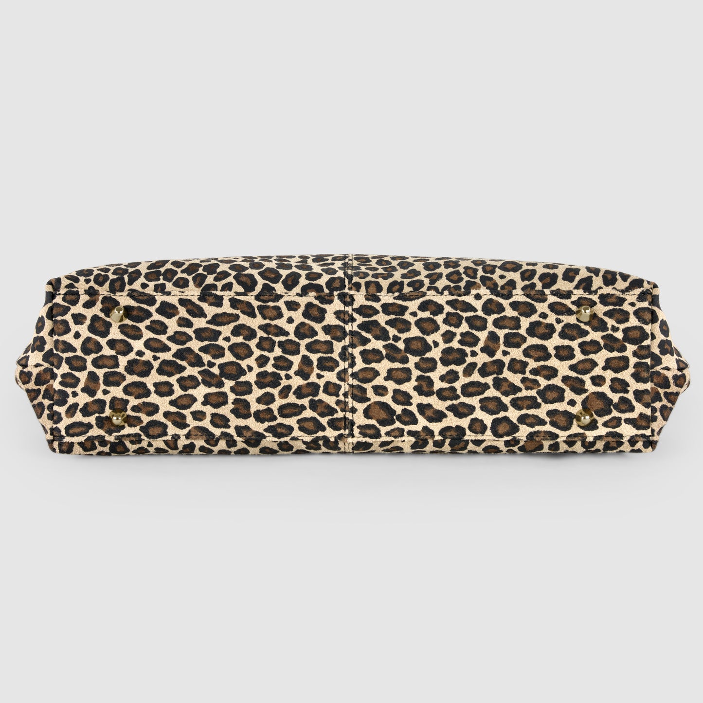 A rectangular Italian-crafted tote with a leopard print pattern in shades of brown, black, and beige, shown from the bottom against a plain white background.