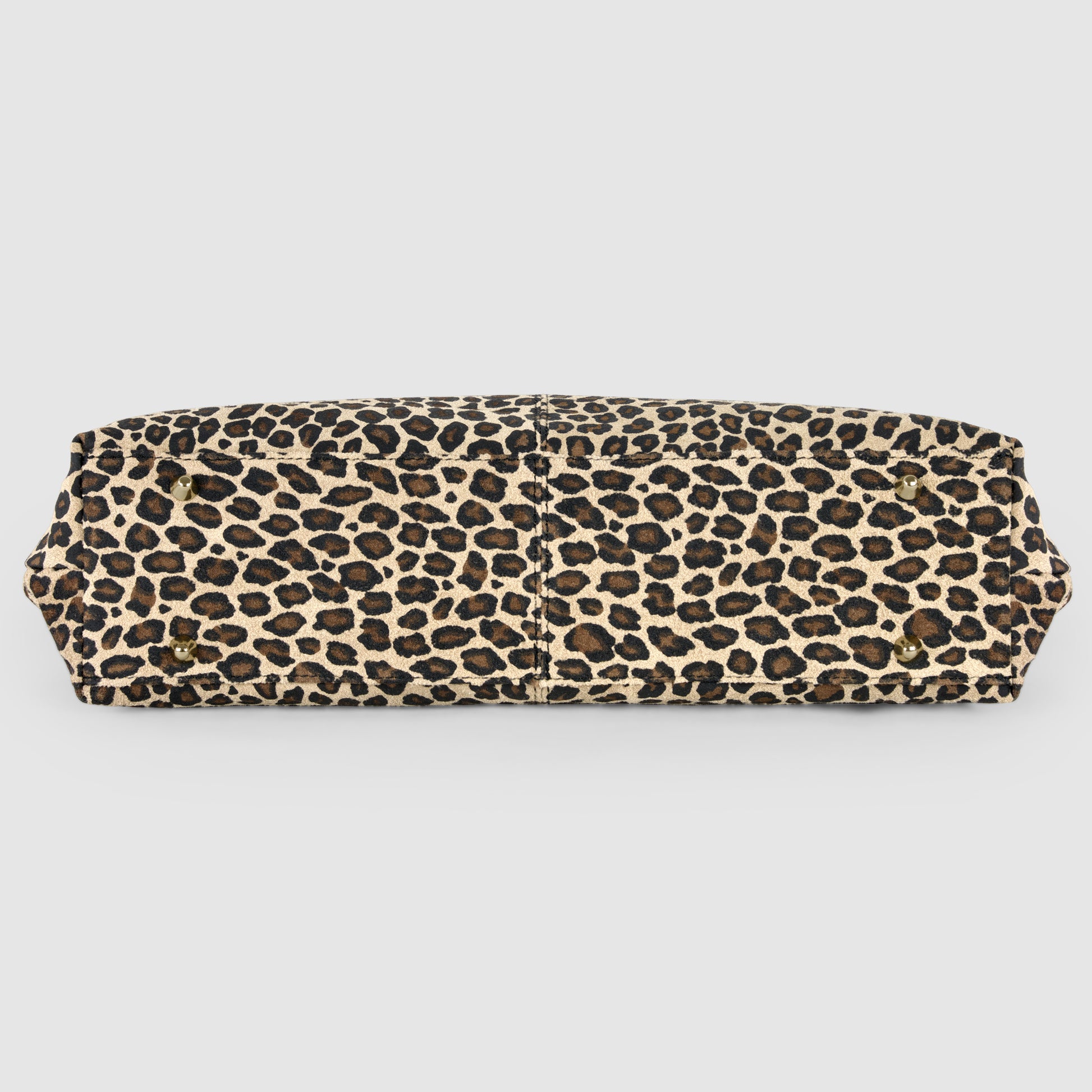 A rectangular Italian-crafted tote with a leopard print pattern in shades of brown, black, and beige, shown from the bottom against a plain white background.