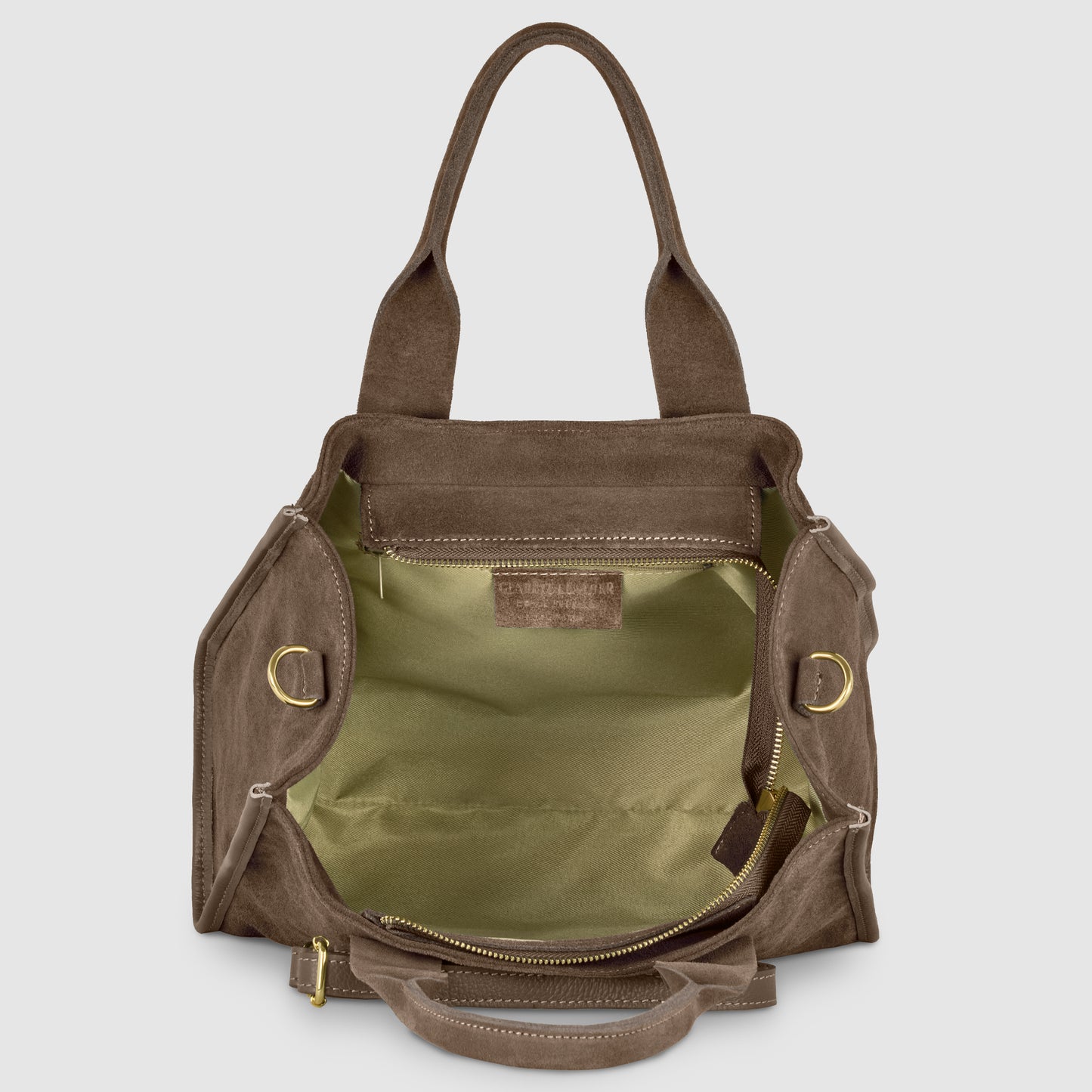 An open brown canvas tote bag with a structured shape, gold-tone hardware, beige fabric lining, and two handles. Showcasing Italian craftsmanship, the bag is empty, displaying its spacious interior and internal leather label.