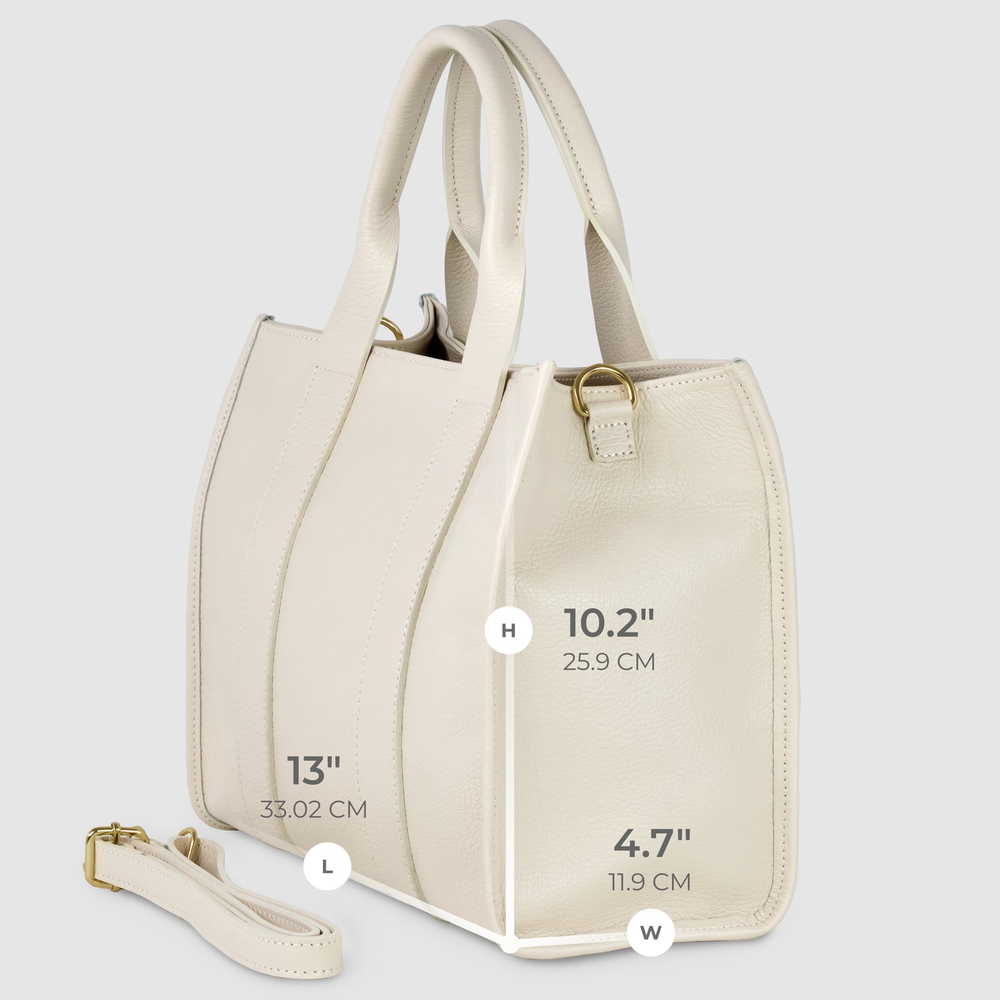 A cream-colored Italian leather handbag with dual handles and a detachable strap. This handcrafted handbag measures 13" long, 10.2" high, and 4.7" wide with gold-tone hardware. Dimensions are labeled in inches and centimeters.