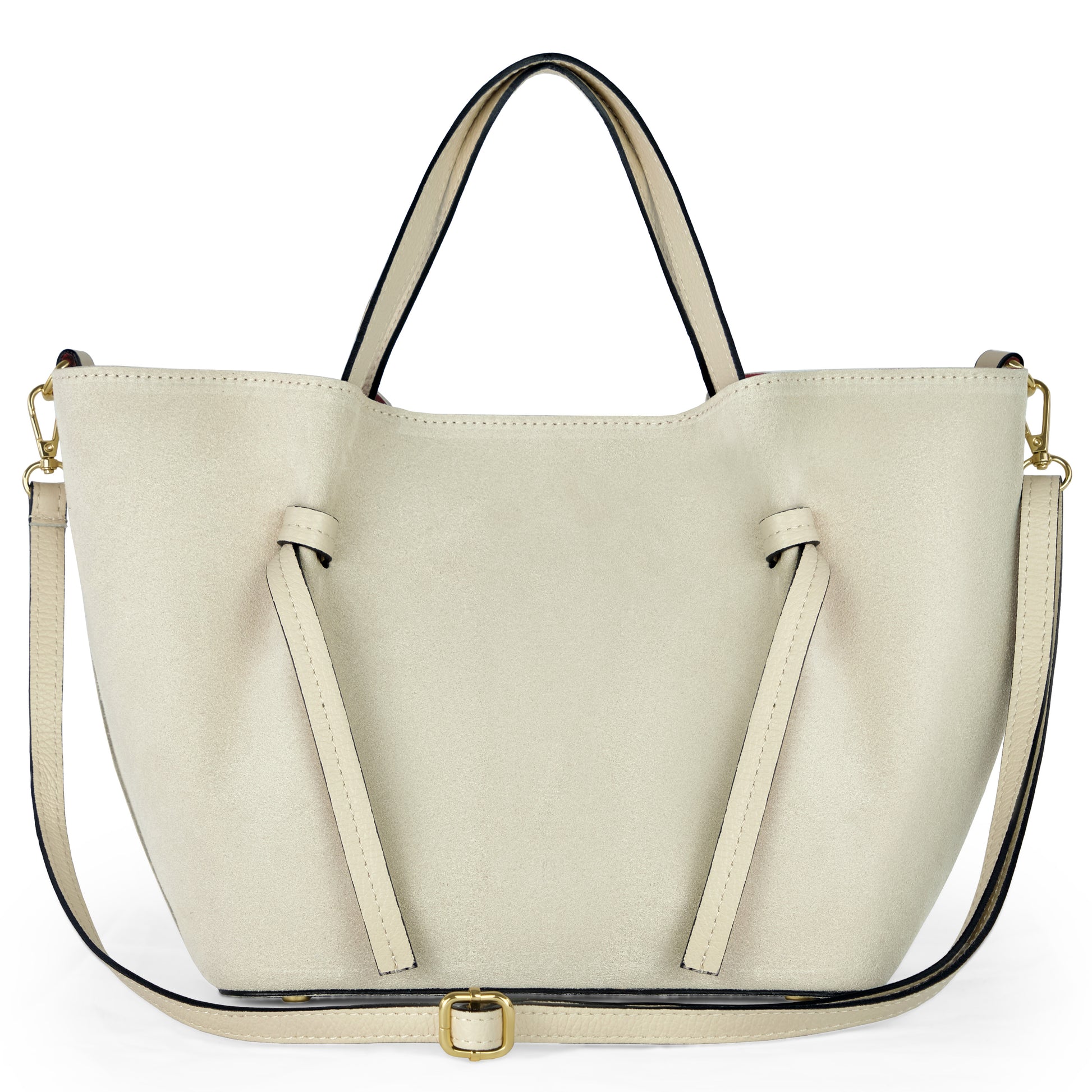 A beige suede tote inspired by Florentine leatherwork, featuring two short handles, front decorative straps, and a long adjustable shoulder strap with gold-tone hardware, displayed against a white background.