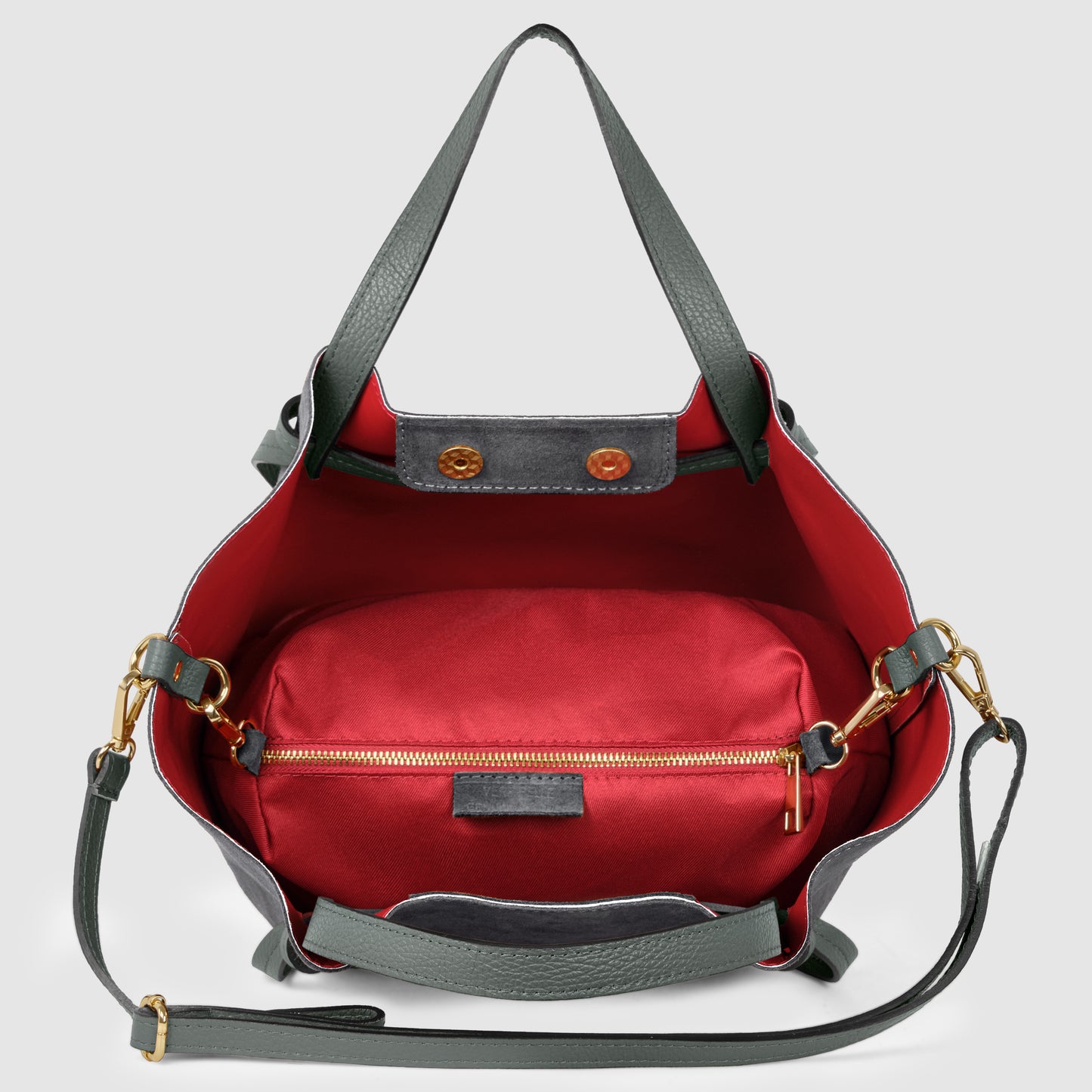 A handmade tote crafted from green leather with gold hardware features a red interior and a detachable red zippered pouch inside. This piece of Florentine leatherwork includes a long green shoulder strap for easy carrying.