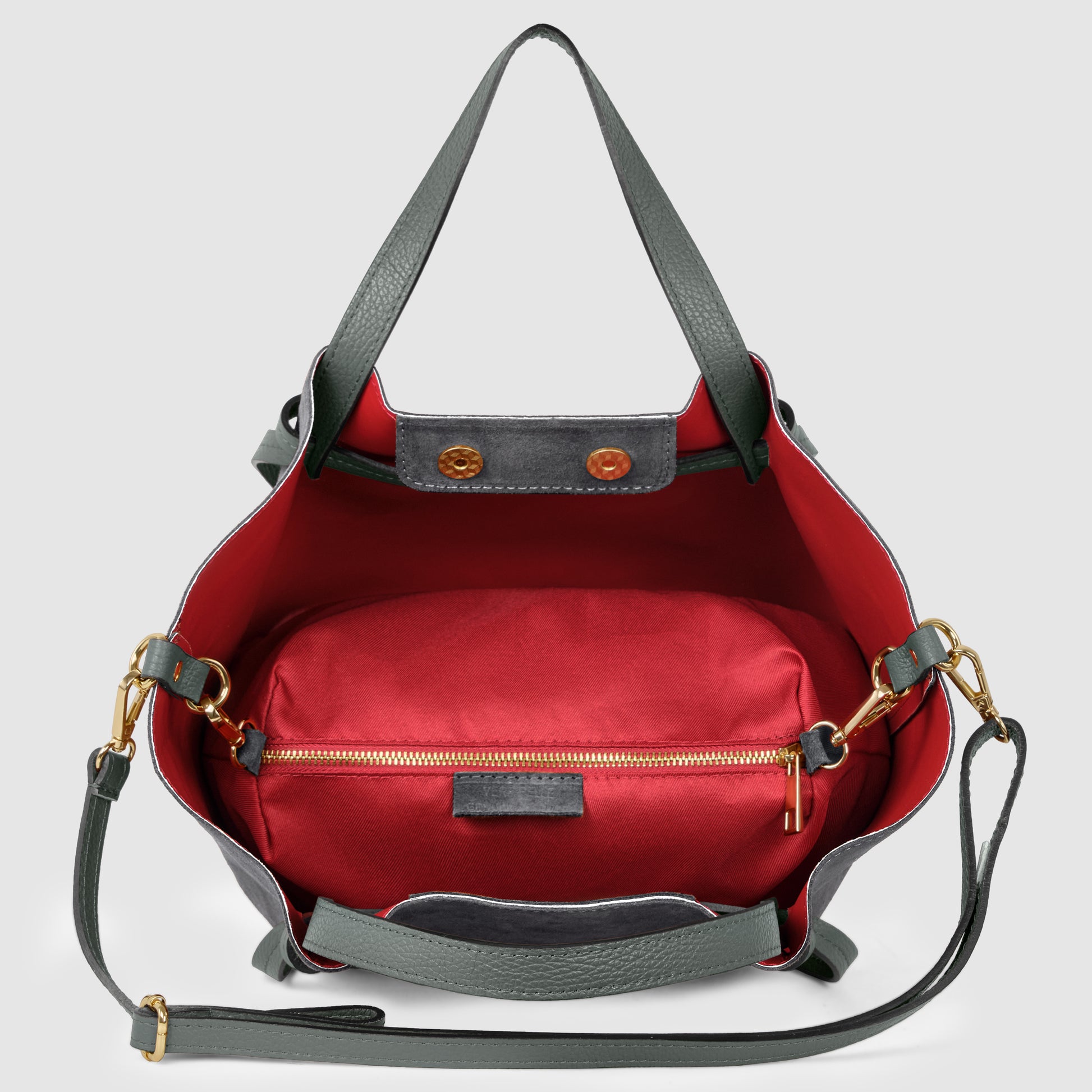 A handmade tote crafted from green leather with gold hardware features a red interior and a detachable red zippered pouch inside. This piece of Florentine leatherwork includes a long green shoulder strap for easy carrying.