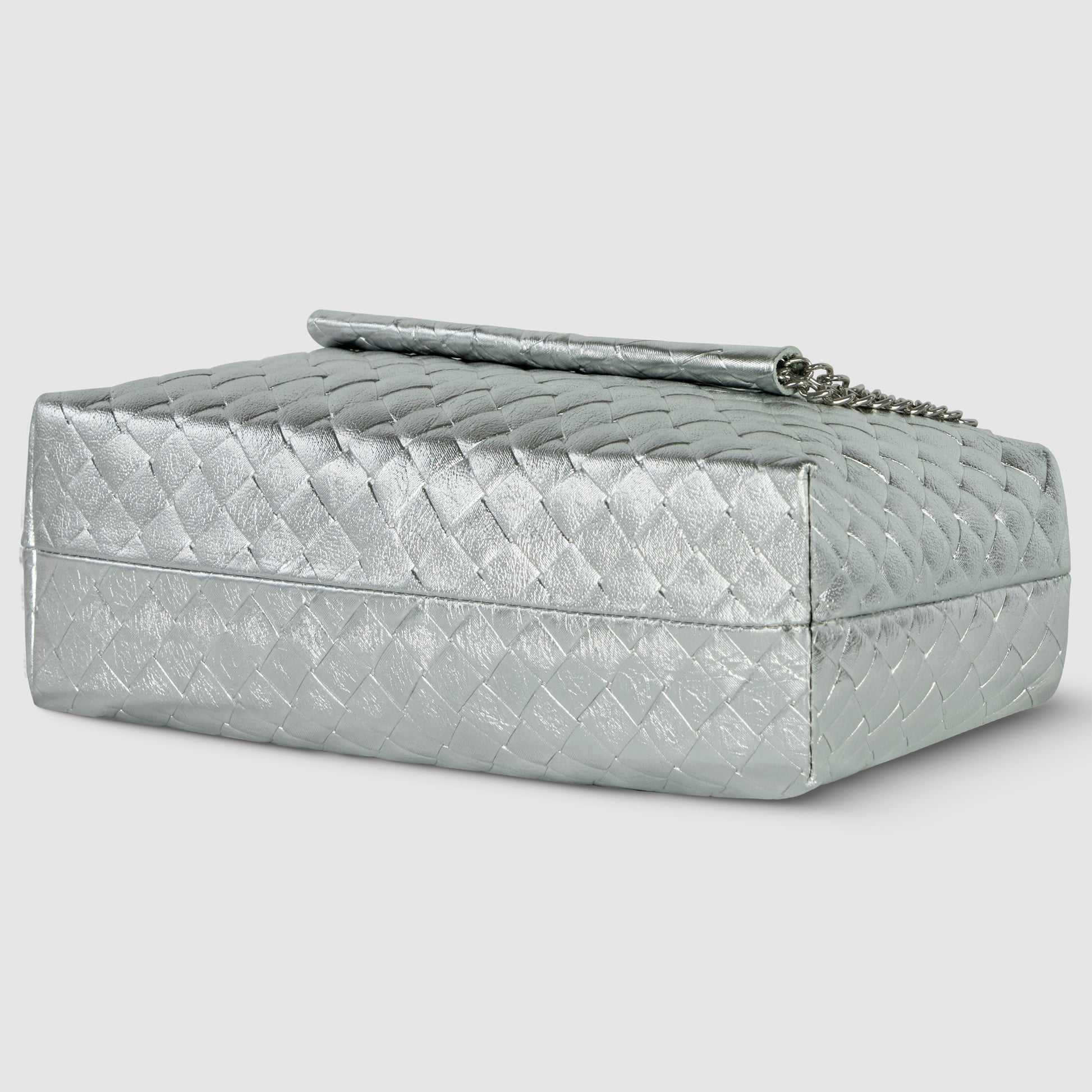 A rectangular silver clutch bag with a woven texture, crafted with exquisite Italian craftsmanship and finished with a silver chain strap, is displayed against a plain light background.