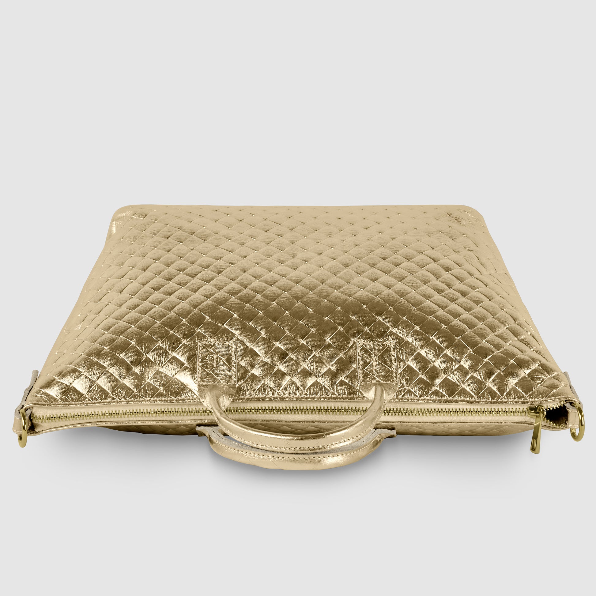 A gold, quilted laptop bag inspired by handcrafted Italian handbag design, featuring two handles and a zipper, displayed against a plain white background.