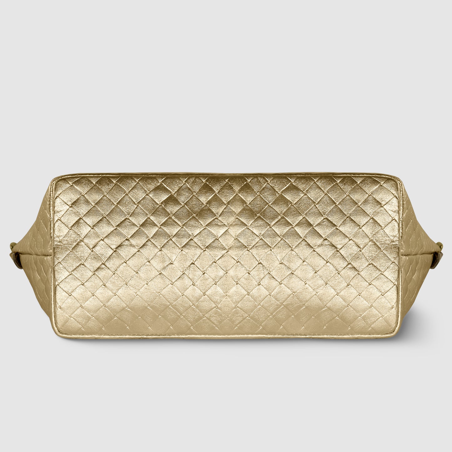 A rectangular gold quilted leather bag, inspired by Florentine leathercraft, is shown from the bottom, displaying a diamond-patterned texture with side edges slightly visible against a plain light background.