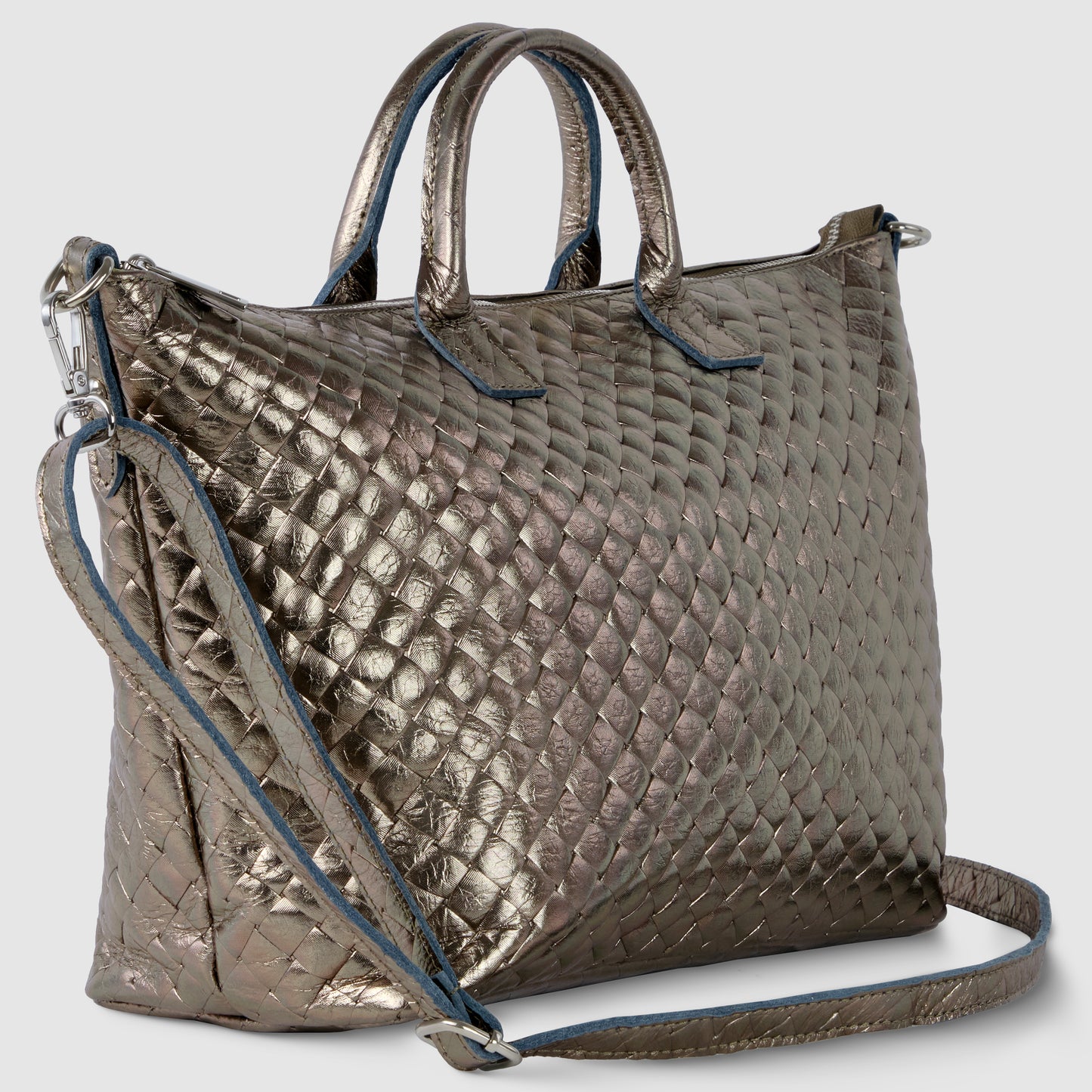 A metallic quilted handbag with short handles and a long adjustable shoulder strap, inspired by handcrafted Italian handbag design, features a diamond pattern texture, blue trim along the edges, and a modern, shiny finish.