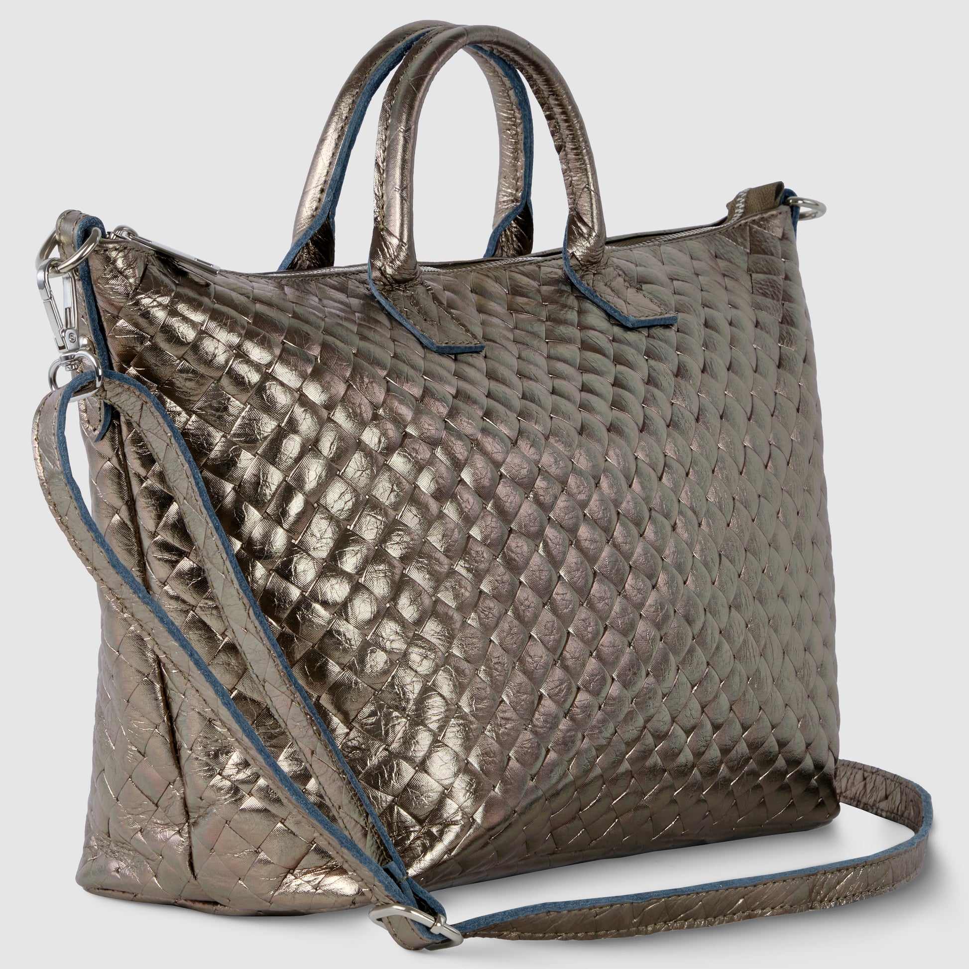 A metallic quilted handbag with short handles and a long adjustable shoulder strap, inspired by handcrafted Italian handbag design, features a diamond pattern texture, blue trim along the edges, and a modern, shiny finish.