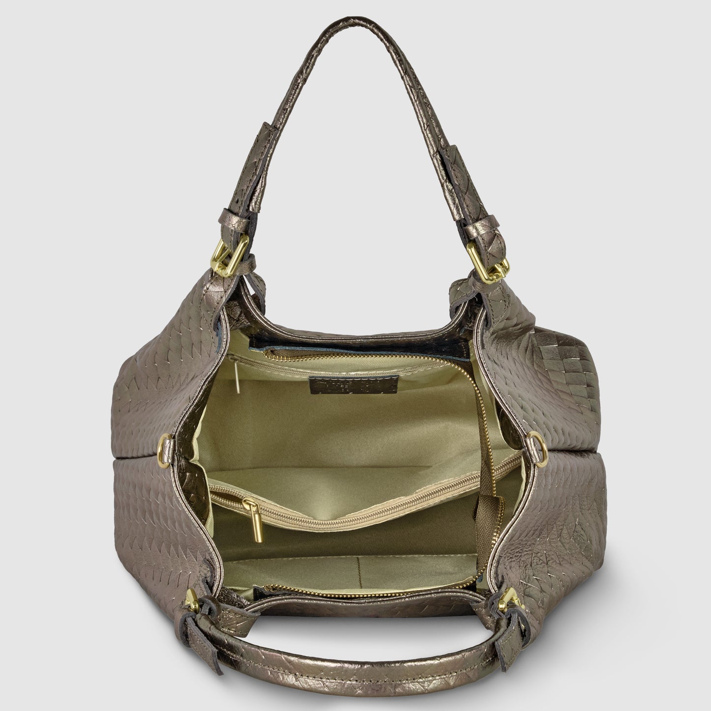 Open brown Florentine leather handbag with gold hardware, revealing a spacious beige fabric interior featuring pockets and a zippered compartment. The bag has two handles and elegant side detailing.