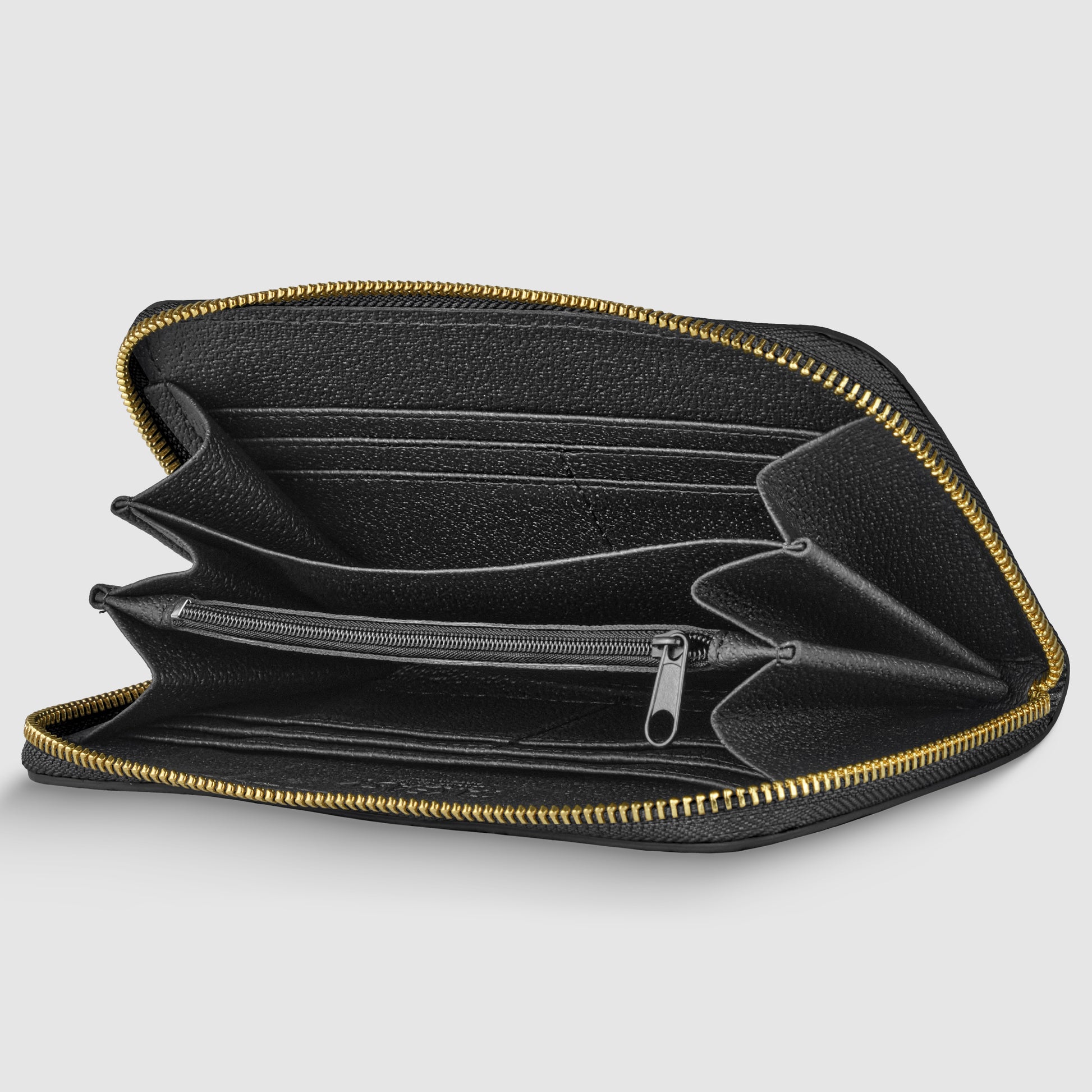 A black Italian leather wallet is open, showing multiple card slots, compartments, and a central zippered pocket. The zipper is gold in color, contrasting with the black leather and highlighting its handcrafted in Italy quality.